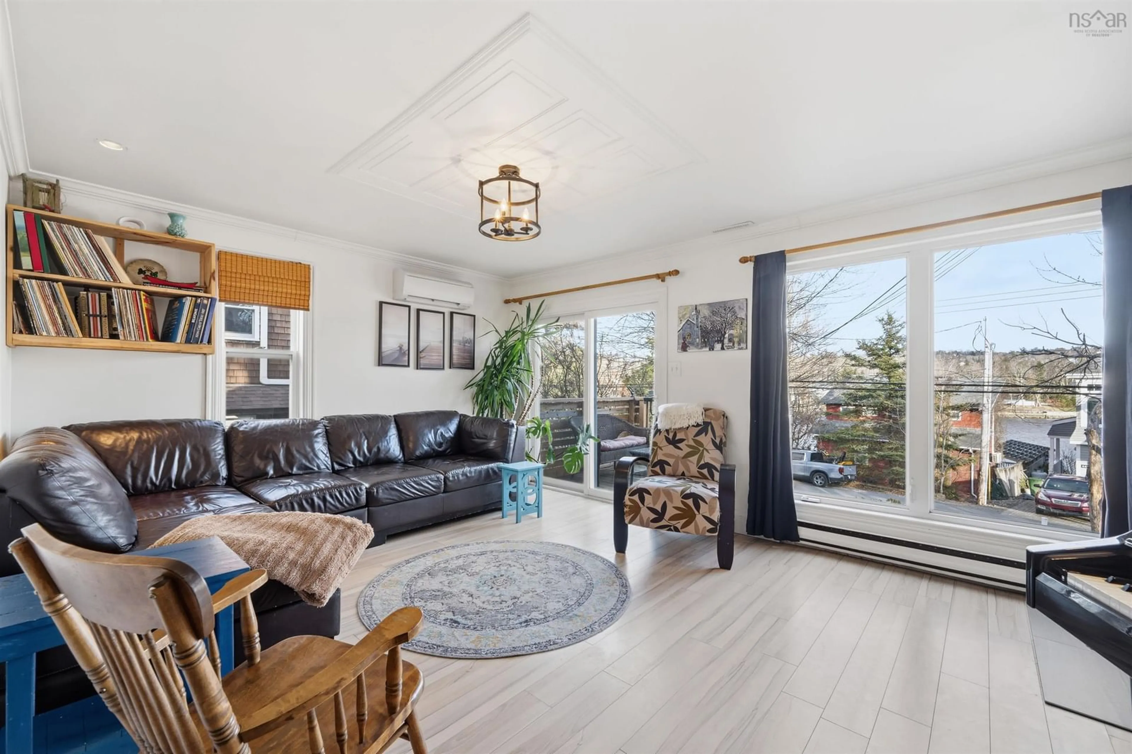Living room with furniture, wood/laminate floor for 450 Shore Dr, Bedford Nova Scotia B4A 2C6