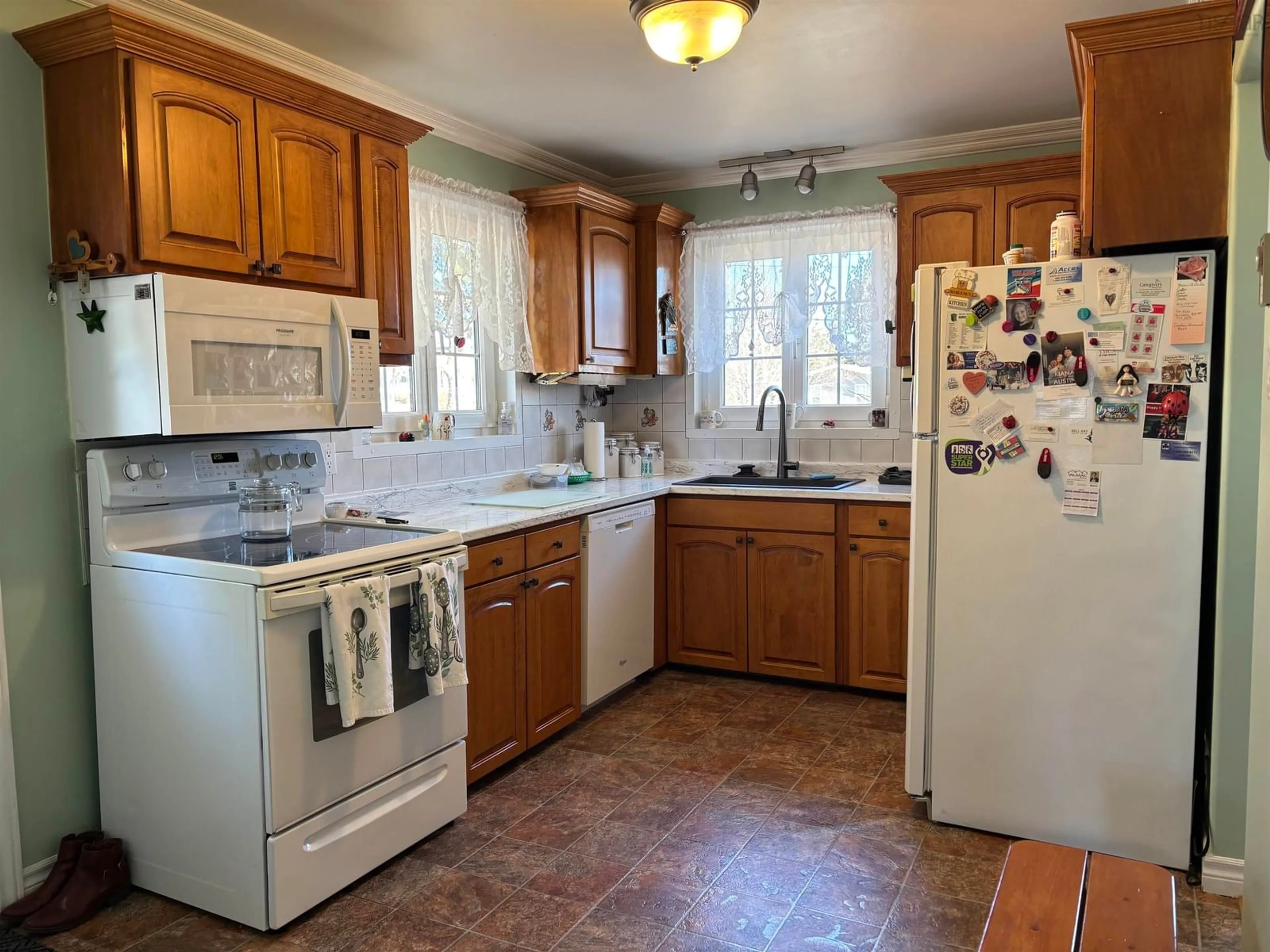 Standard kitchen, ceramic/tile floor for 69 Sunrise Drive, Georges River Nova Scotia B1Y 3B9