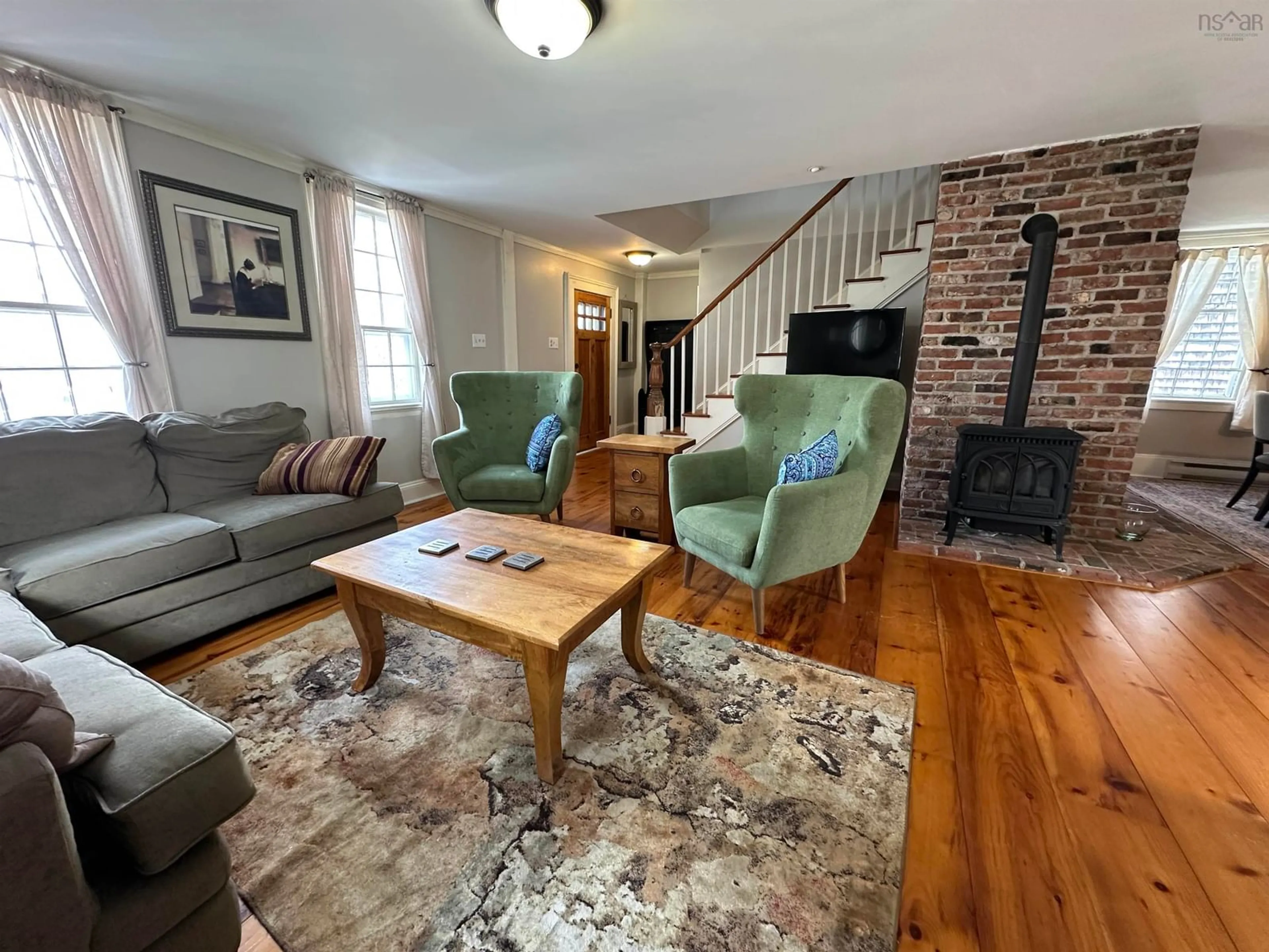 Living room with furniture, wood/laminate floor for 71 Main St, Liverpool Nova Scotia B0T 1K0