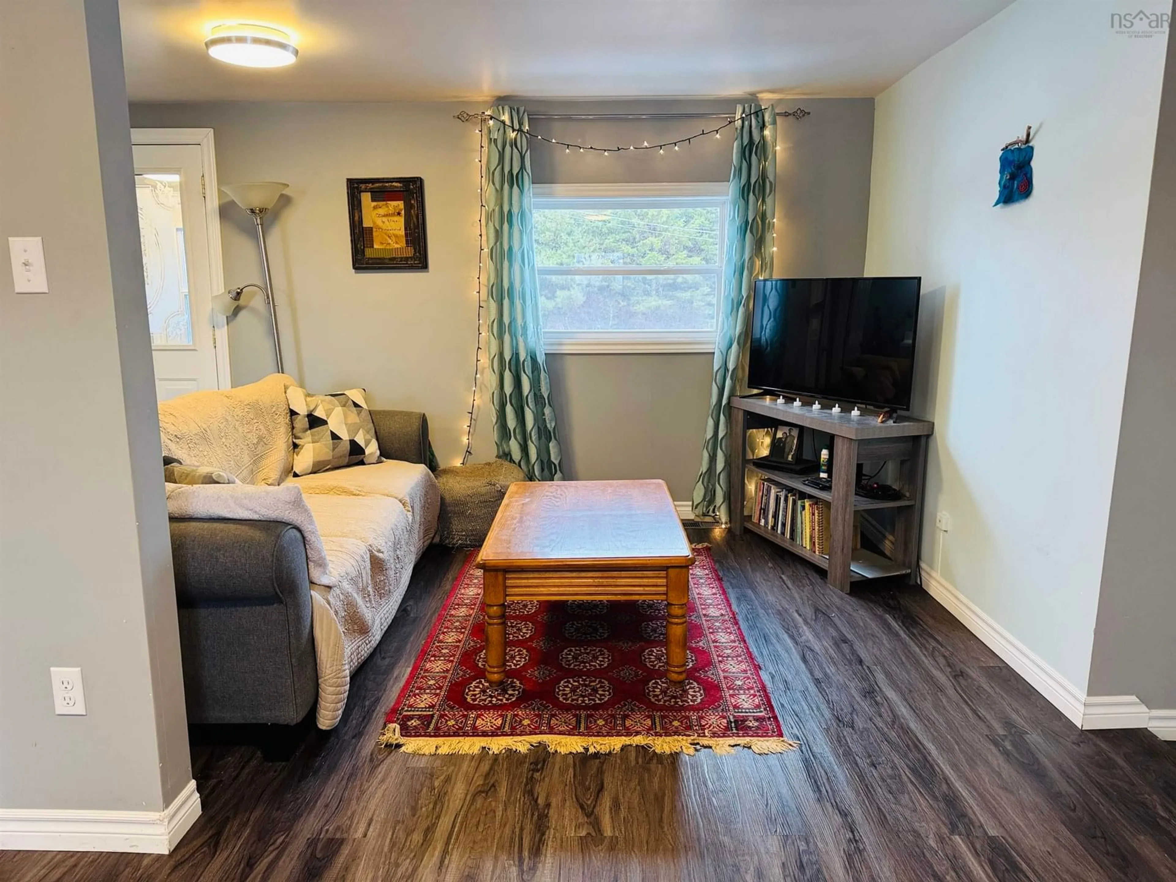 Living room with furniture, wood/laminate floor for 1787 Western Ave, Parrsboro Nova Scotia B0M 1S0