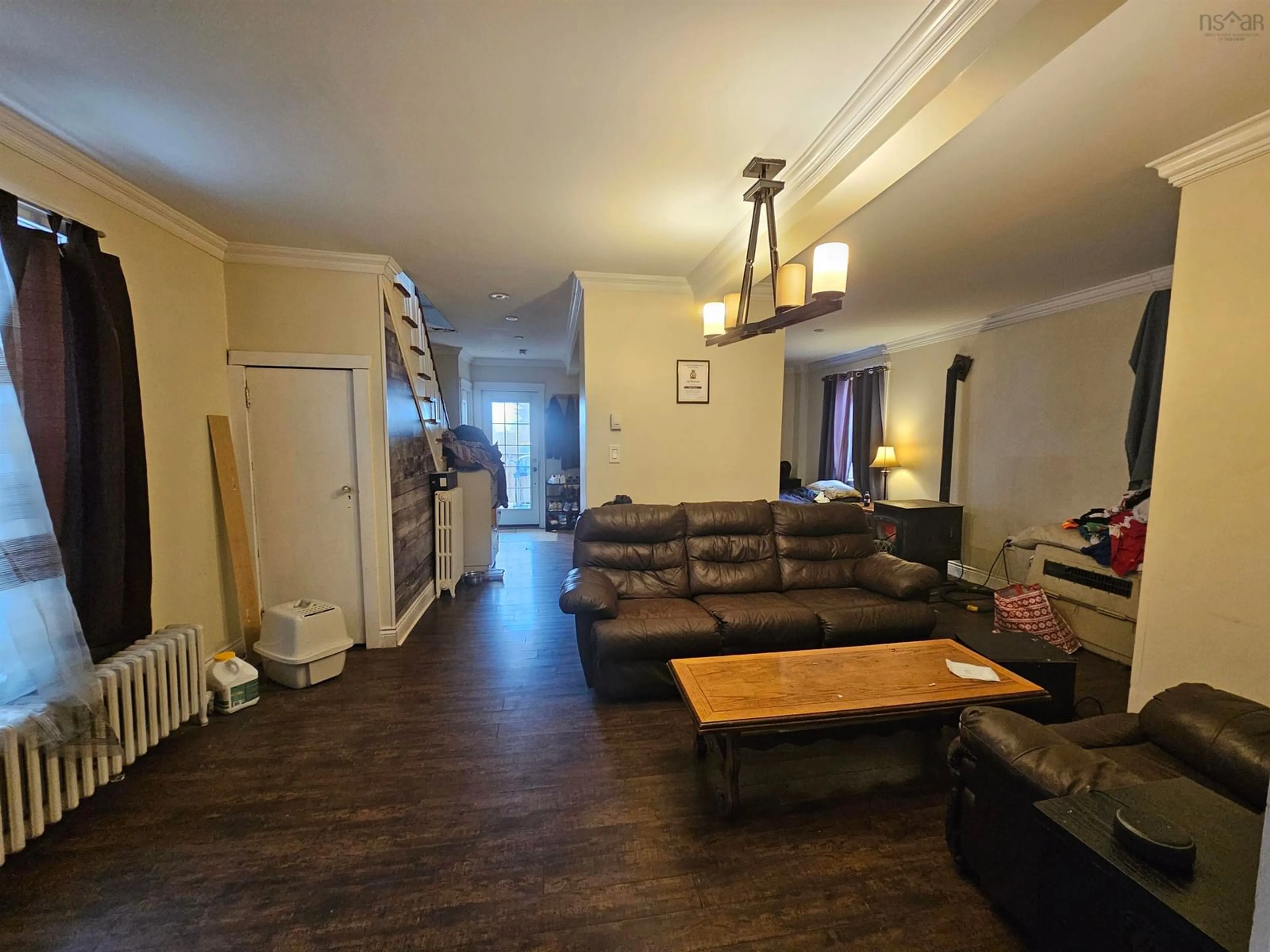 Living room with furniture, wood/laminate floor for 26 Windsor Ave, Sydney Mines Nova Scotia B1Y 2J7