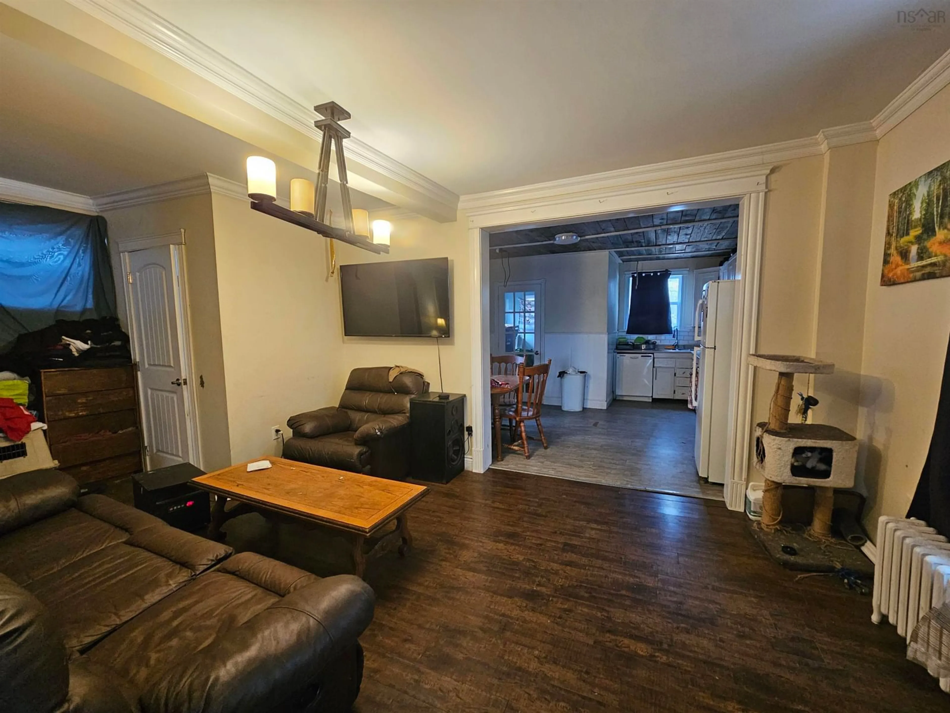 Living room with furniture, wood/laminate floor for 26 Windsor Ave, Sydney Mines Nova Scotia B1Y 2J7