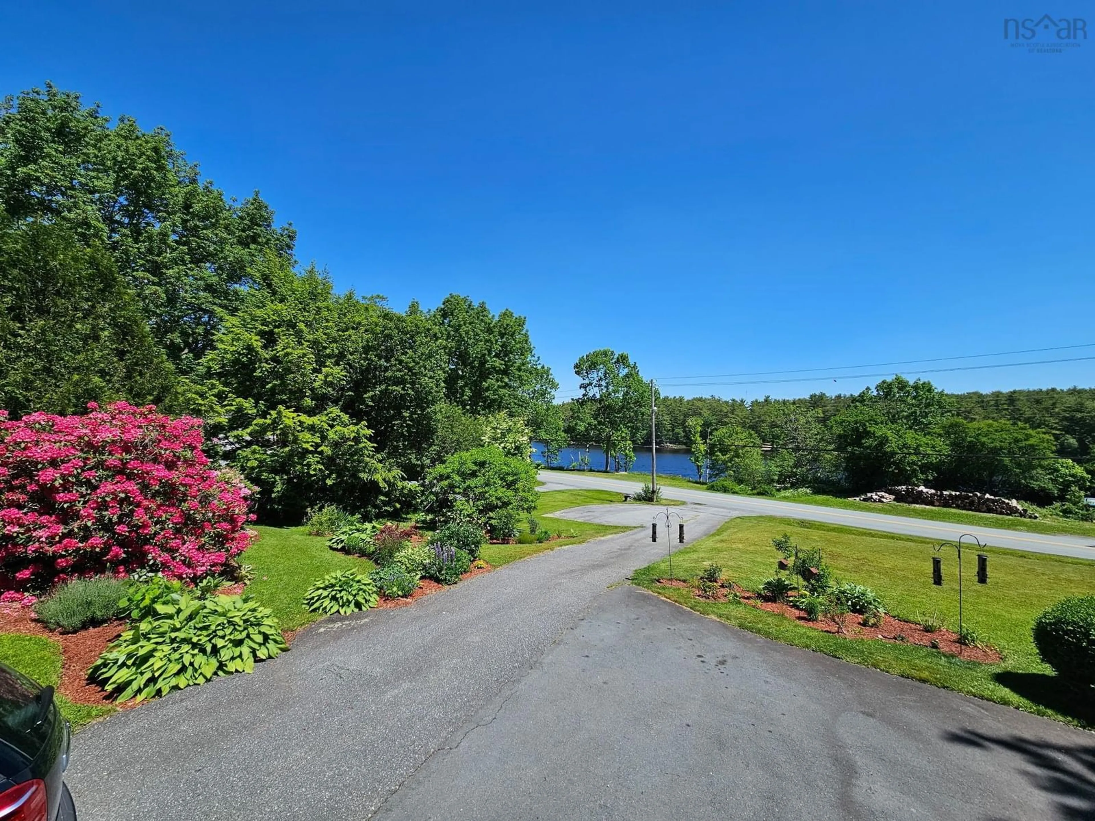A pic from outside/outdoor area/front of a property/back of a property/a pic from drone, water/lake/river/ocean view for 86 West St, Milton Nova Scotia B0T 1P0