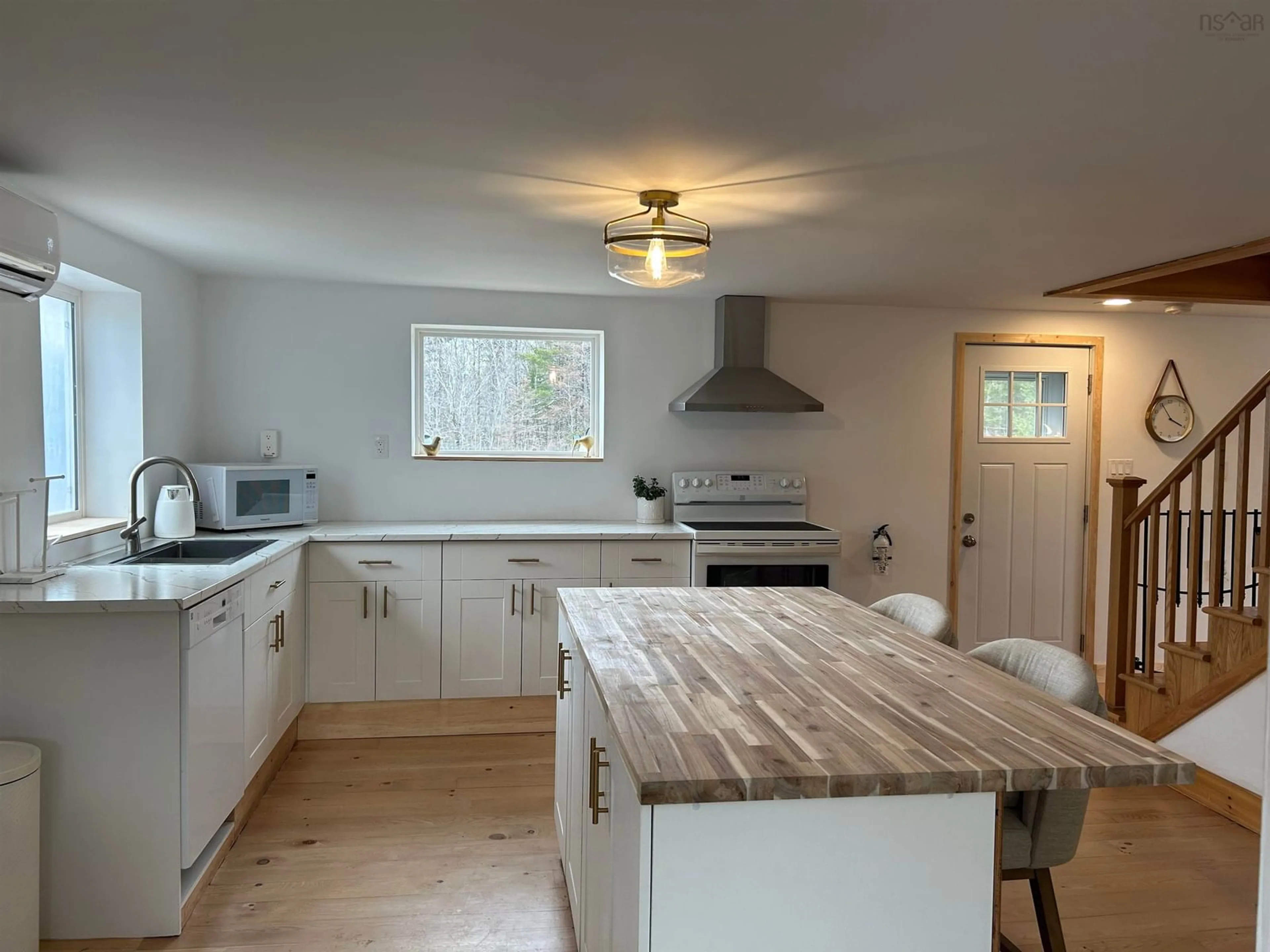 Open concept kitchen, wood/laminate floor for 1318 Sweetland Rd, Sweetland Nova Scotia B0J 1E0