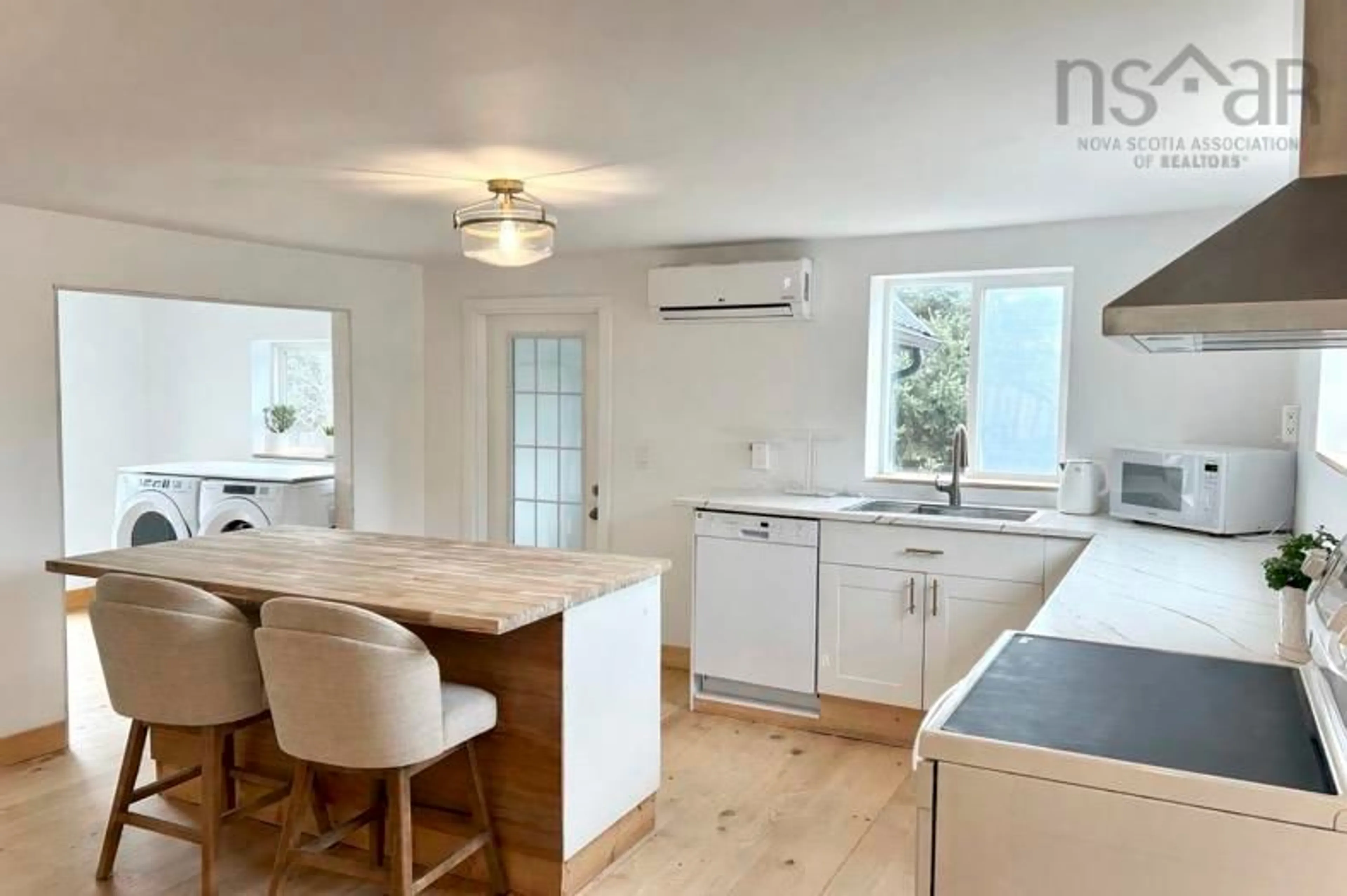 Open concept kitchen, wood/laminate floor for 1318 Sweetland Rd, Sweetland Nova Scotia B0J 1E0