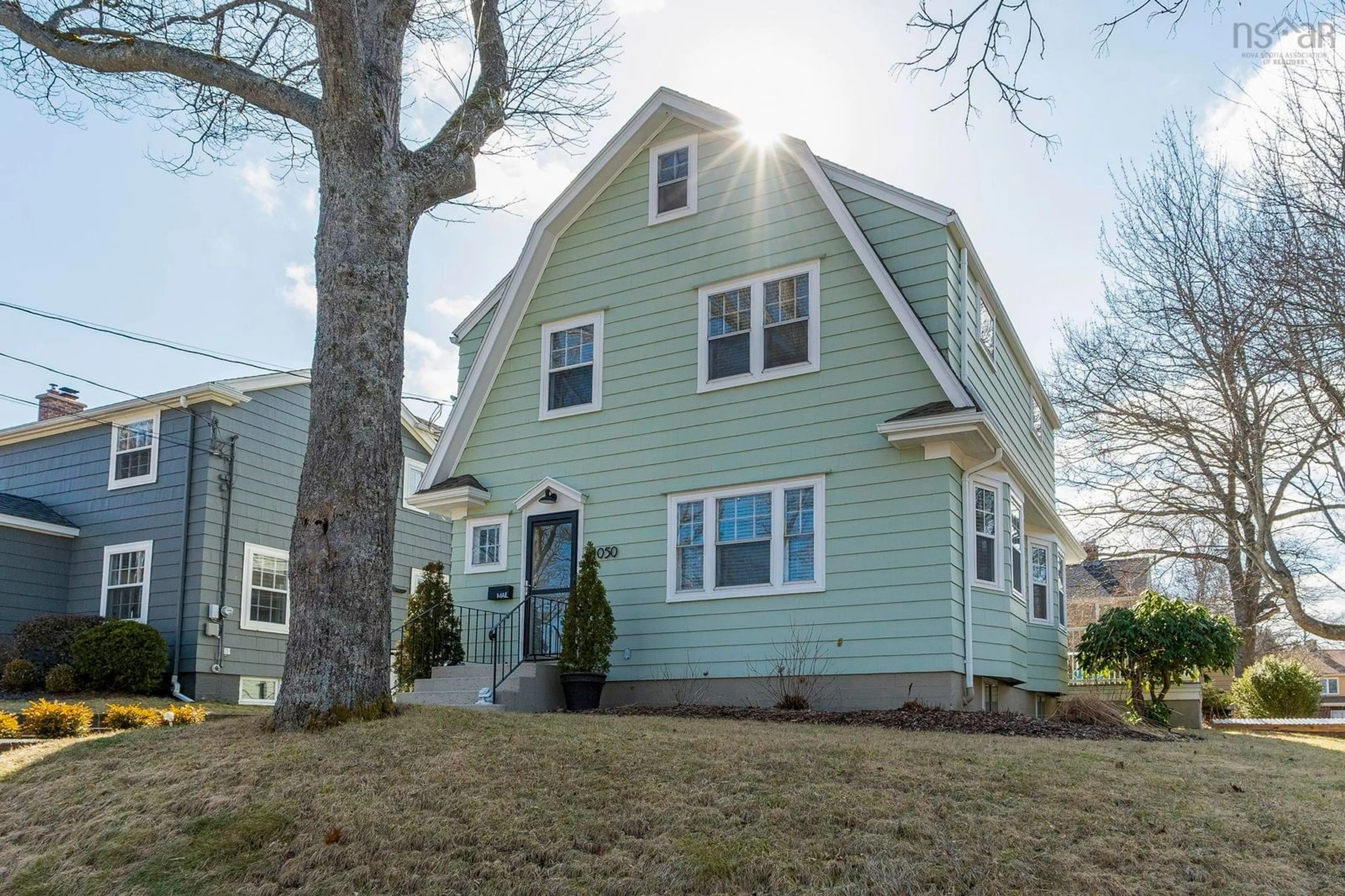Home with vinyl exterior material, street for 1050 Greenwood Ave, Halifax Nova Scotia B3H 3L2