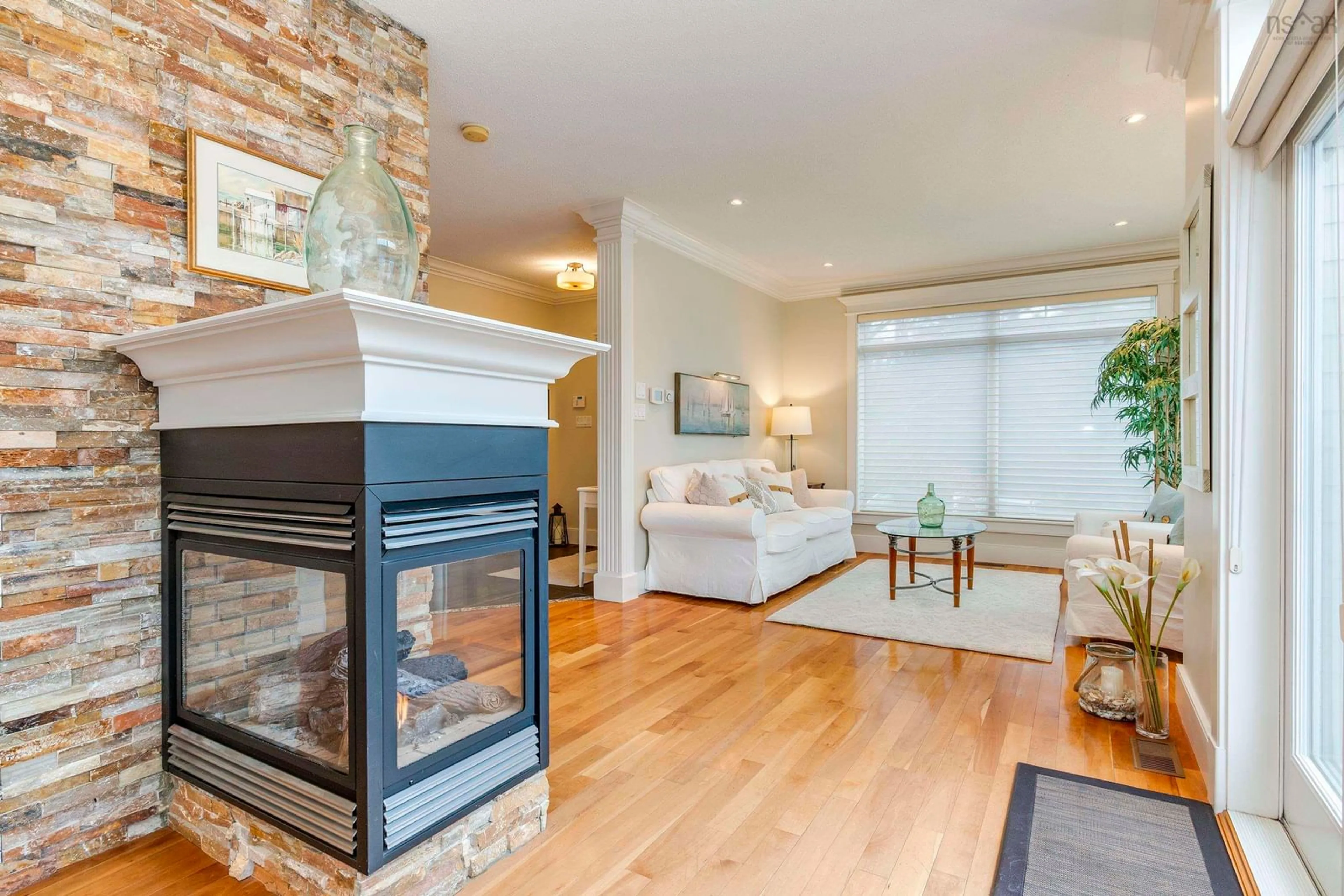 Living room with furniture, wood/laminate floor for 825 Shore Dr, Bedford Nova Scotia B4A 2E3