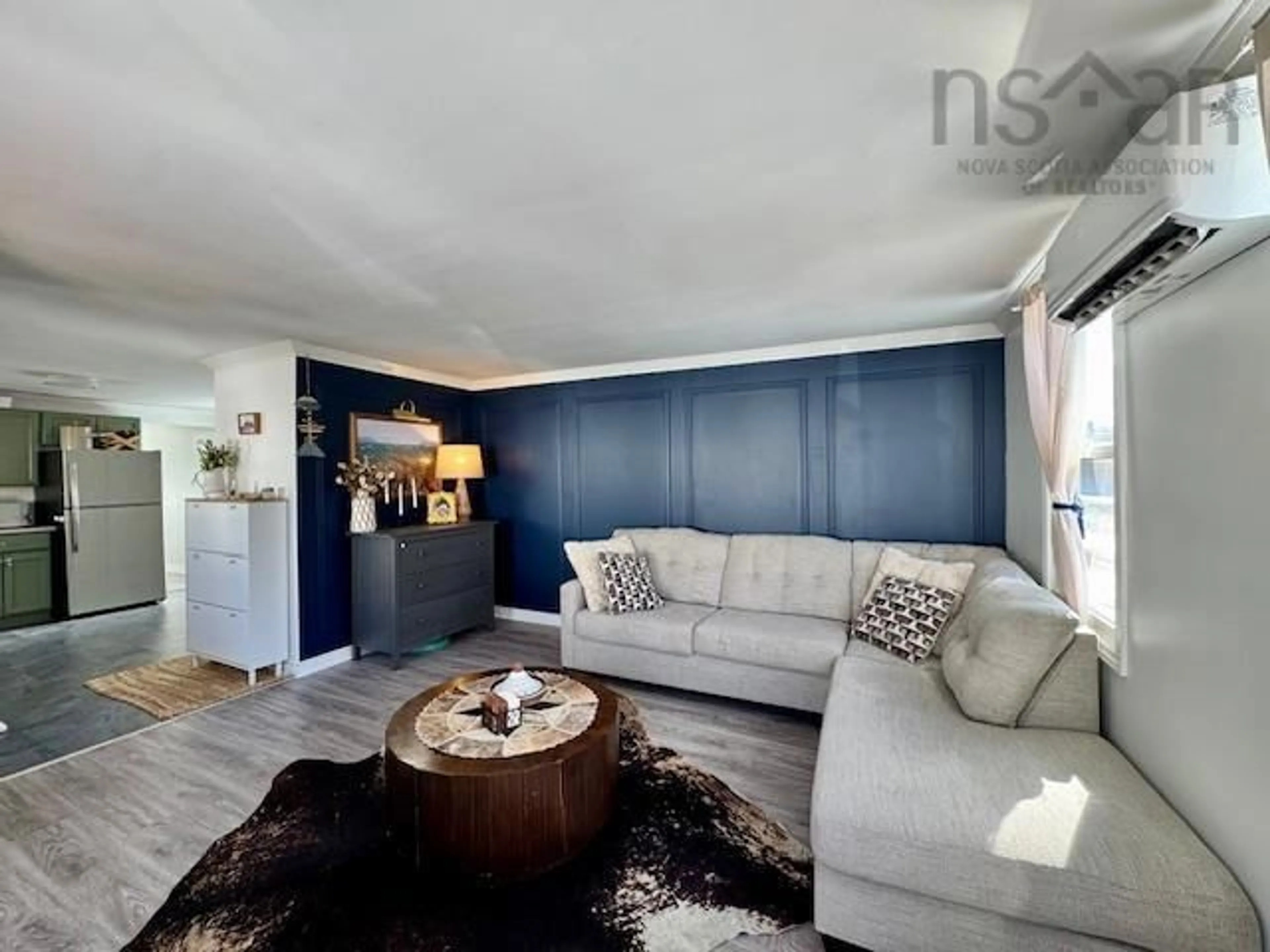 Living room with furniture, wood/laminate floor for 15 Stanley St, Middle Sackville Nova Scotia B4E 1E7