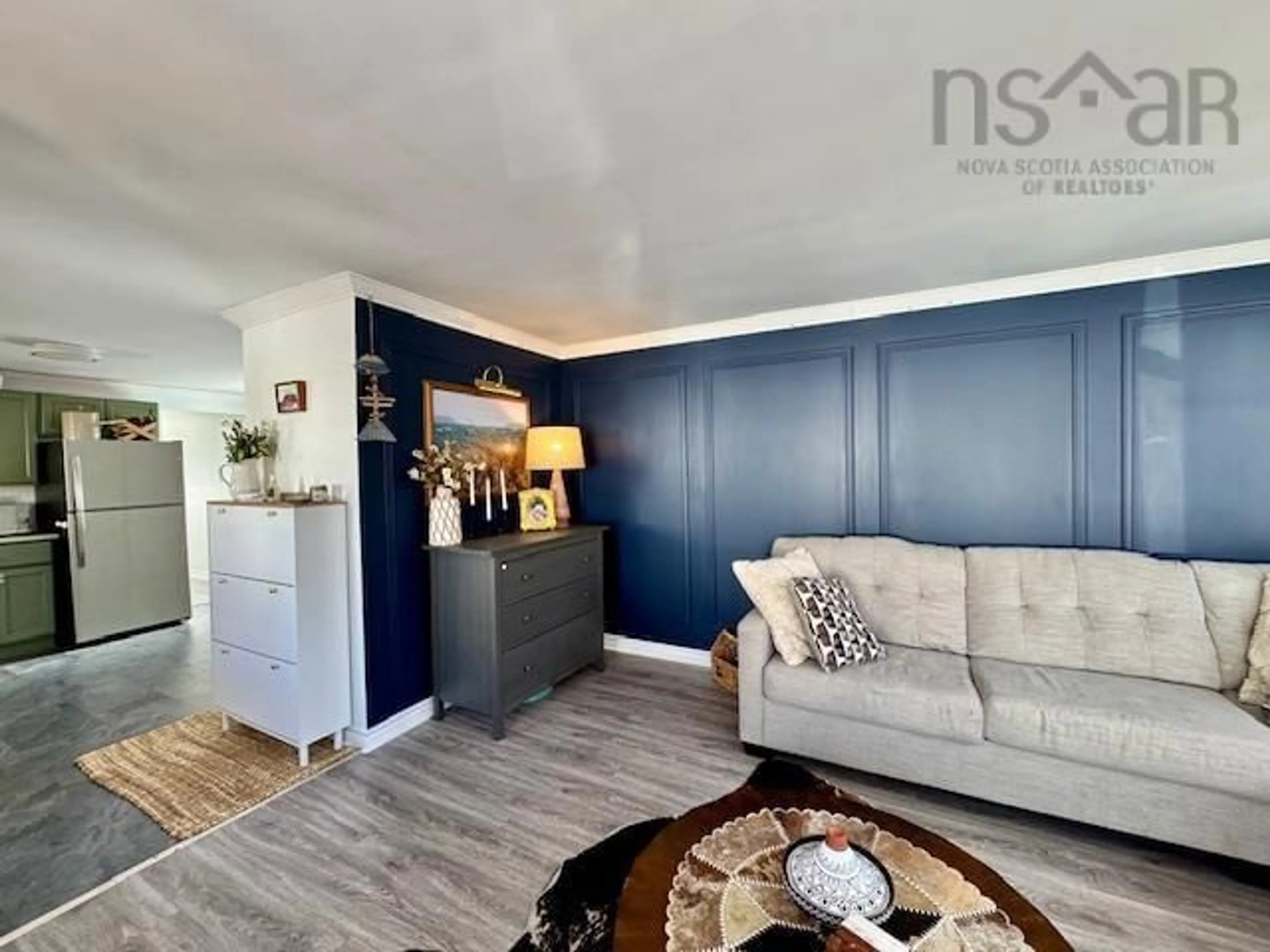 Living room with furniture, wood/laminate floor for 15 Stanley St, Middle Sackville Nova Scotia B4E 1E7