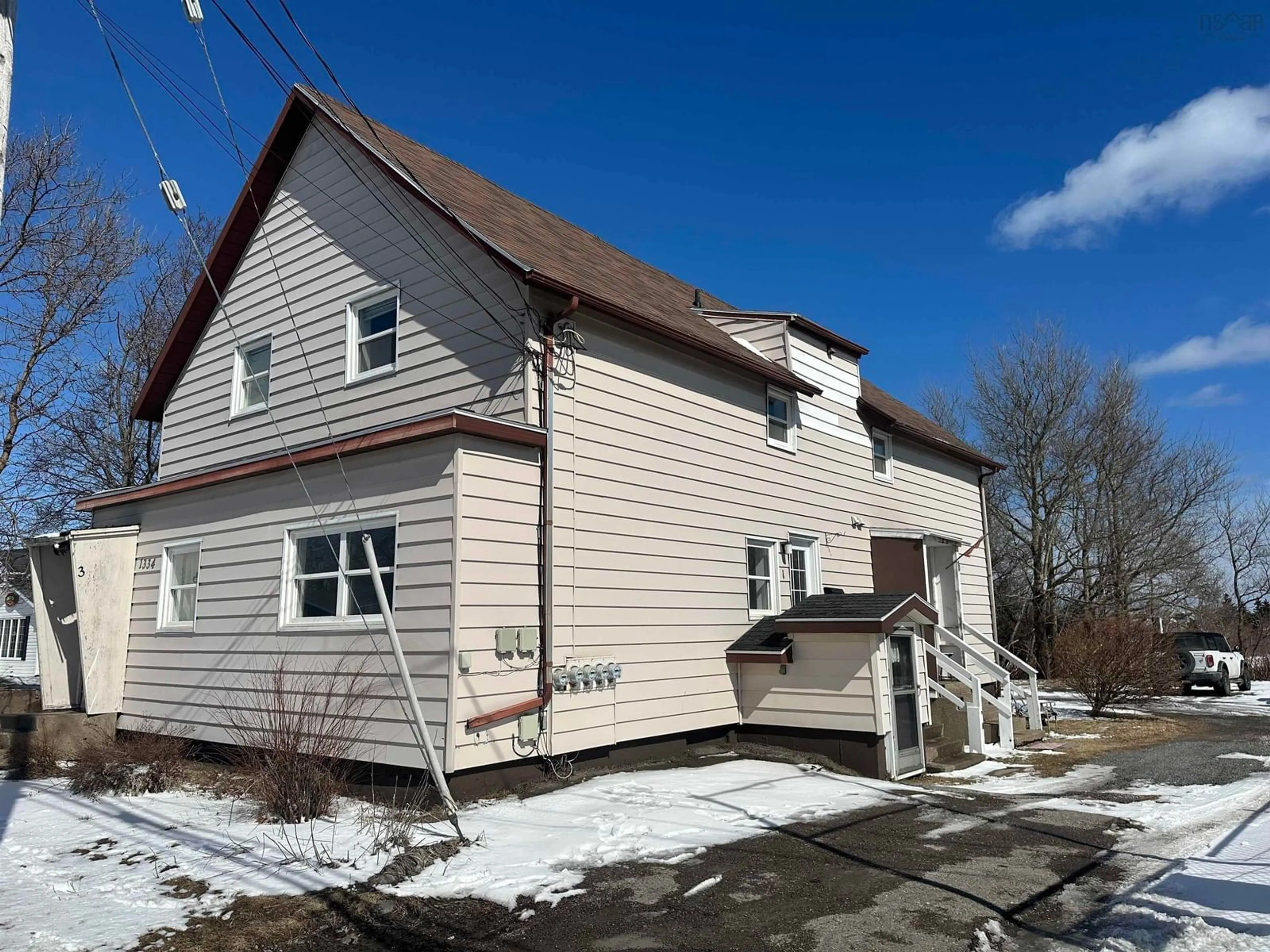 A pic from outside/outdoor area/front of a property/back of a property/a pic from drone, street for 1334 Main St, Glace Bay Nova Scotia B1A 5A7