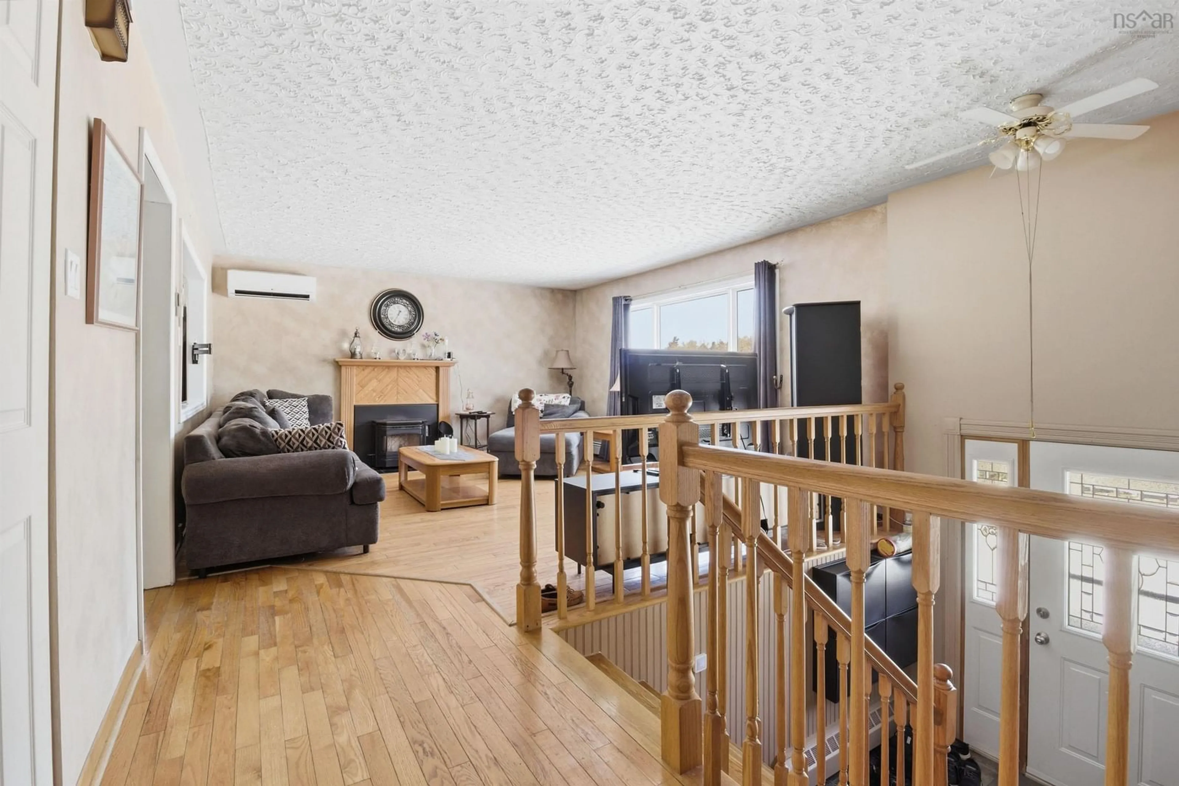Living room with furniture, wood/laminate floor for 42 Meadow Dr, Beaver Bank Nova Scotia B4G 1B5