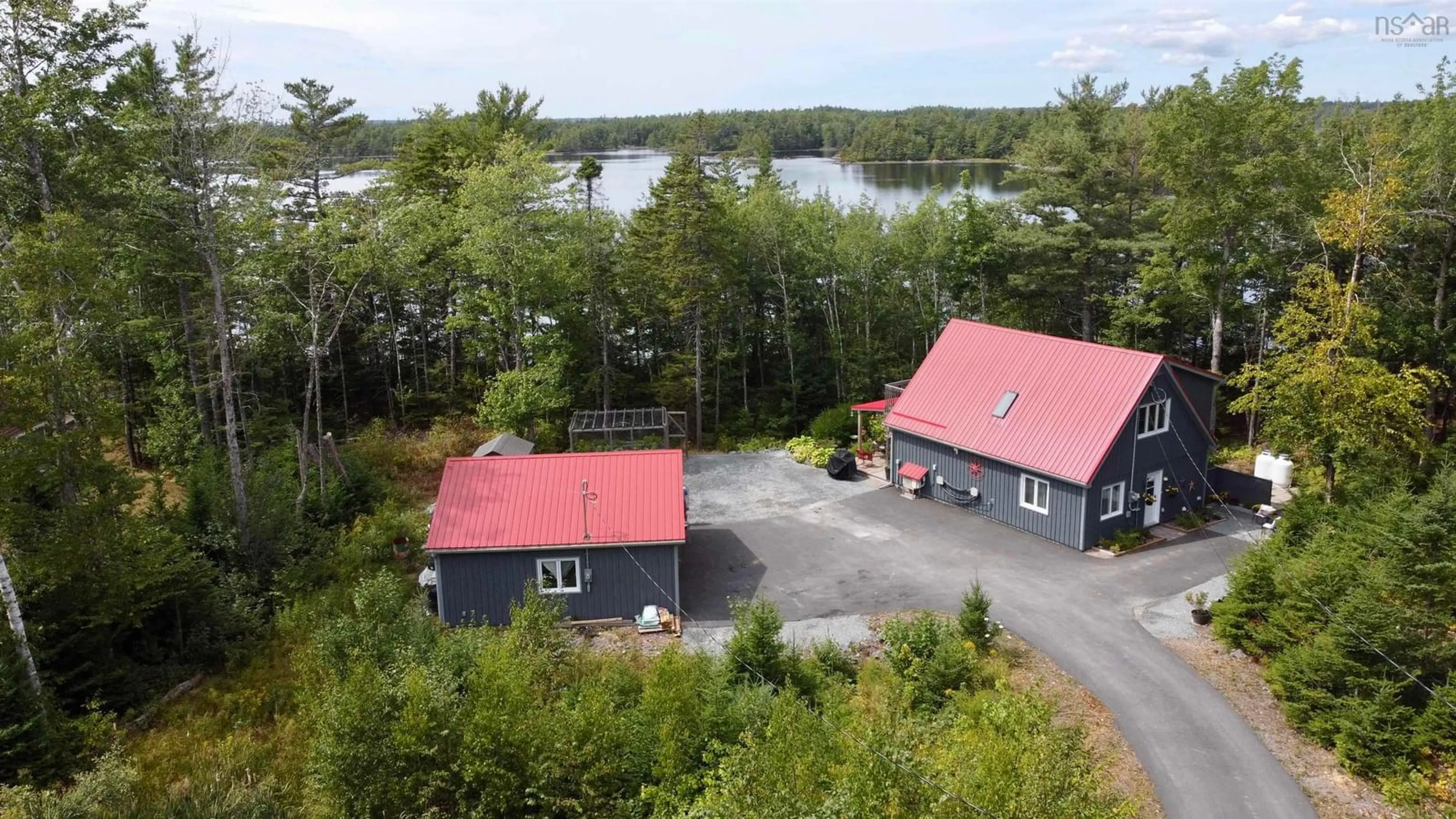 A pic from outside/outdoor area/front of a property/back of a property/a pic from drone, water/lake/river/ocean view for 62 Western Point Lane, East Uniacke Nova Scotia B0N 1Z0