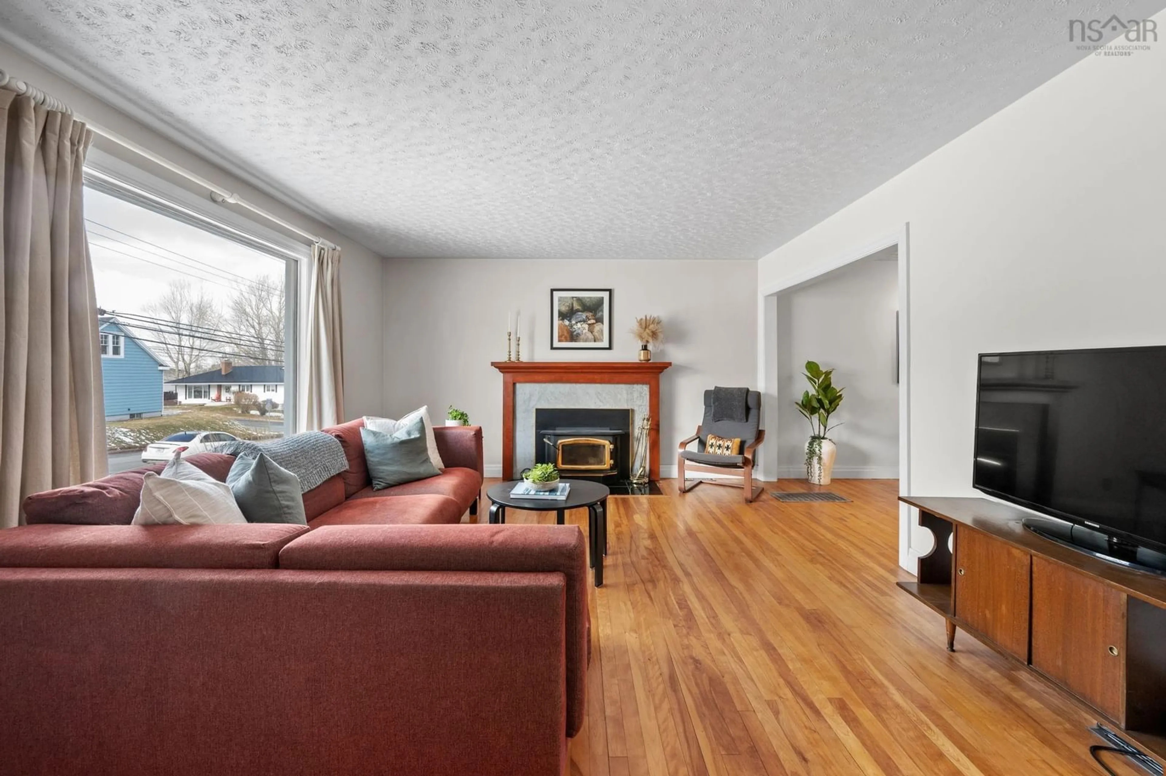 Living room with furniture, wood/laminate floor for 197 Pleasant St, Truro Nova Scotia B2N 3S7