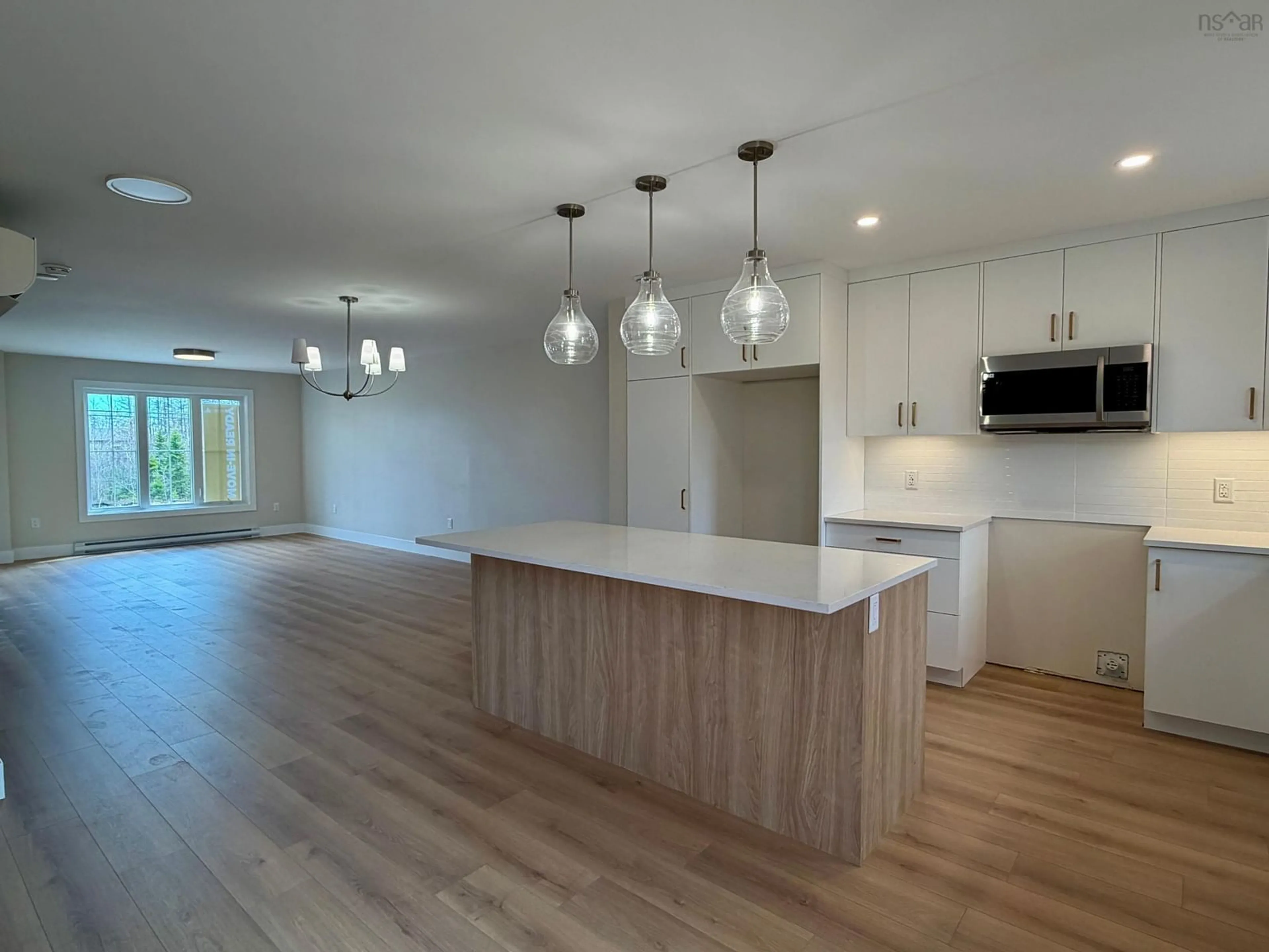 Open concept kitchen, wood/laminate floor for 63 Lew Cres #L042B, Lantz Nova Scotia B2S 0H9
