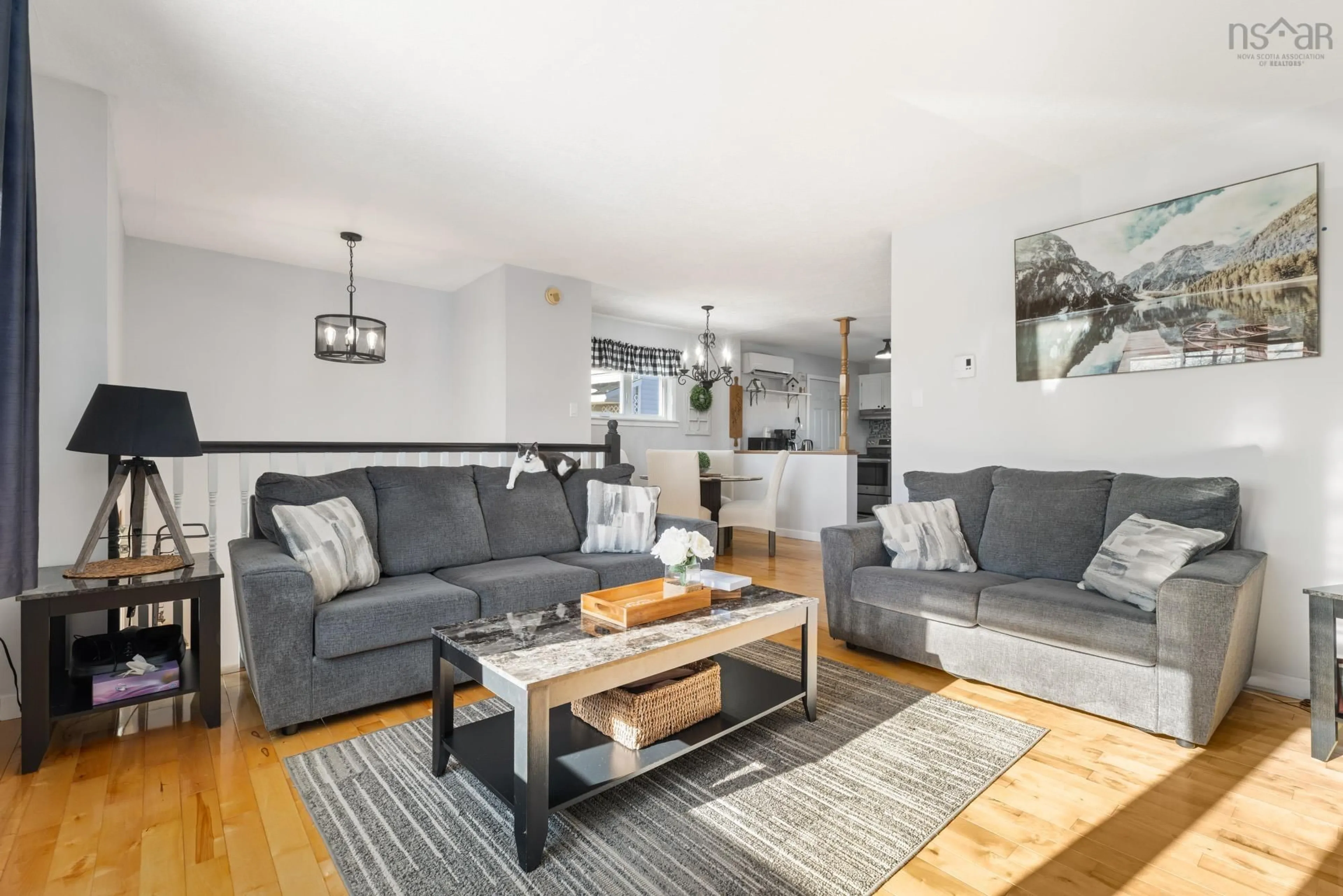 Living room with furniture, wood/laminate floor for 2060 Caldwell Rd, Eastern Passage Nova Scotia B3G 1H7