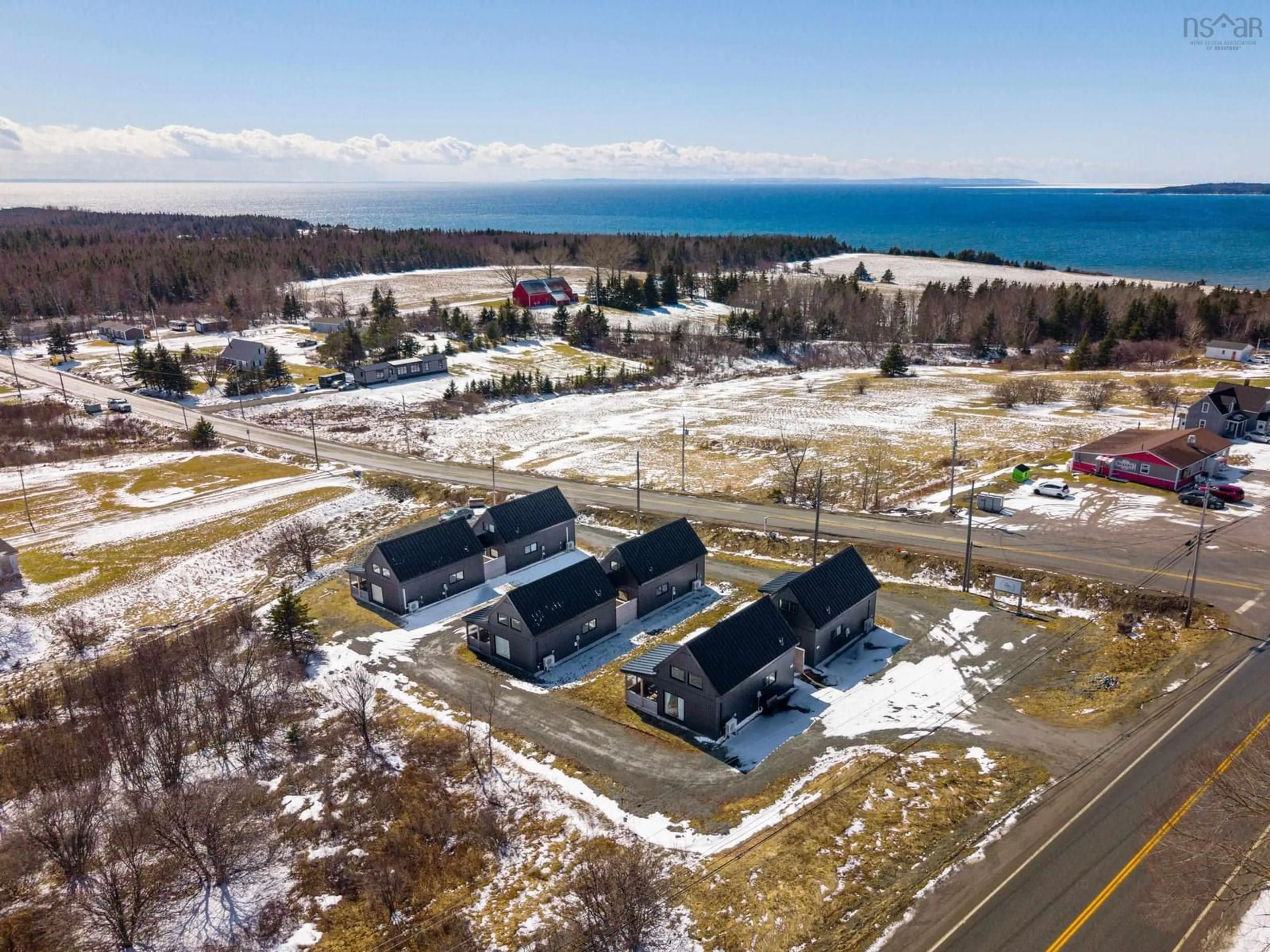 A pic from outside/outdoor area/front of a property/back of a property/a pic from drone, water/lake/river/ocean view for 15 Shore Rd, Harbourview Nova Scotia B0E 2W0