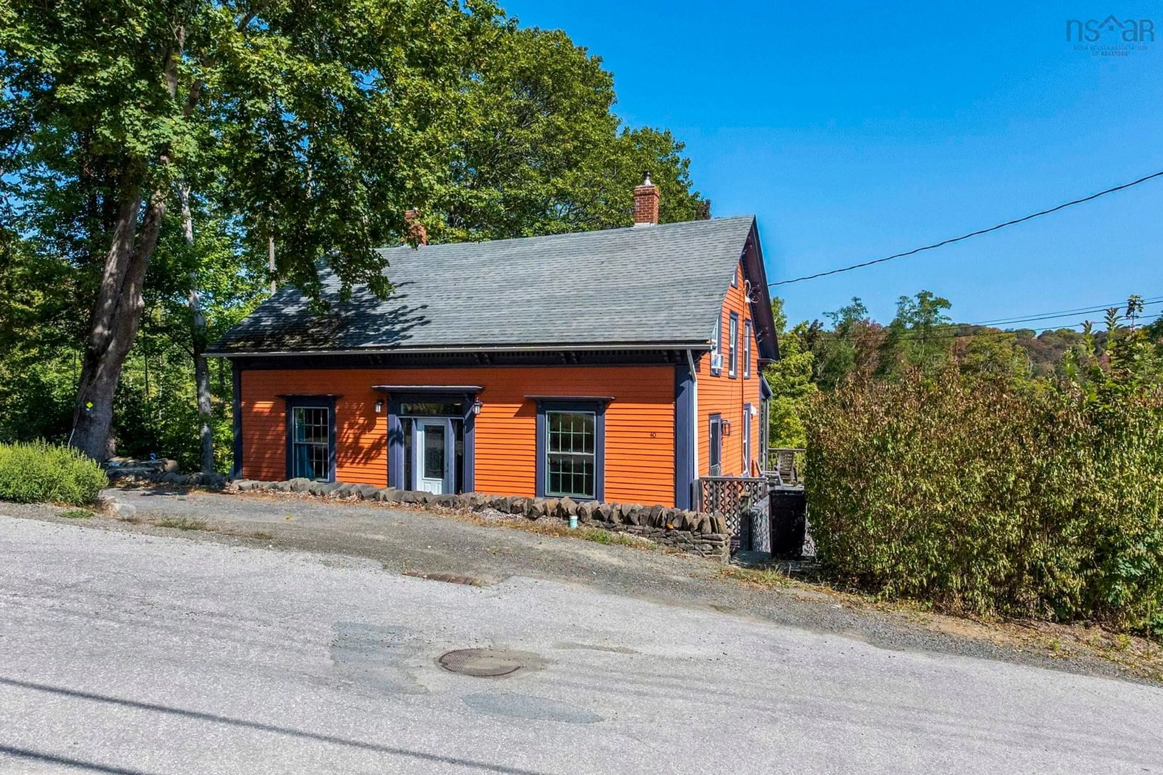 A pic from outside/outdoor area/front of a property/back of a property/a pic from drone, building for 40 Pleasant St, Bear River Nova Scotia B0S 1B0