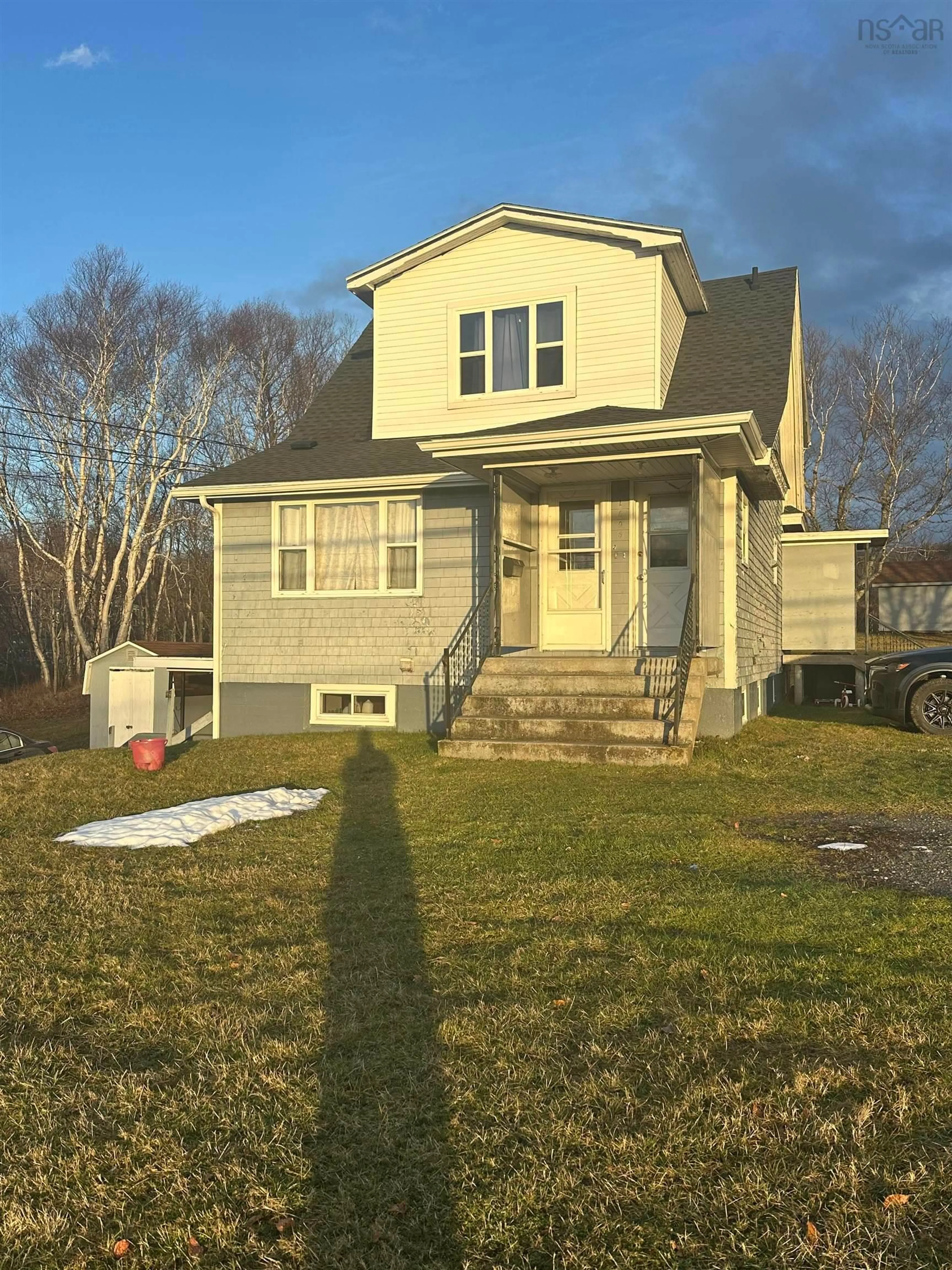 Home with vinyl exterior material, street for 1696 Victoria Rd, Sydney Nova Scotia B1N 1N3