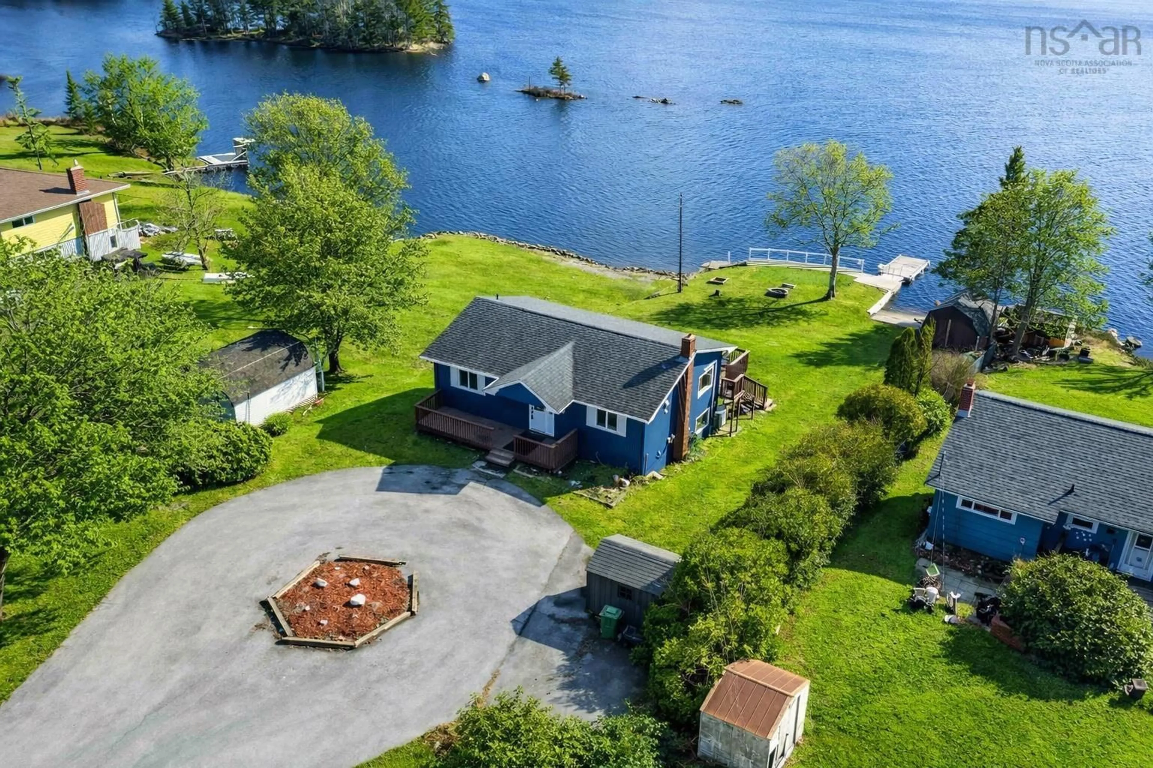 A pic from outside/outdoor area/front of a property/back of a property/a pic from drone, water/lake/river/ocean view for 31 Millside Dr, Porters Lake Nova Scotia B3E 1J4