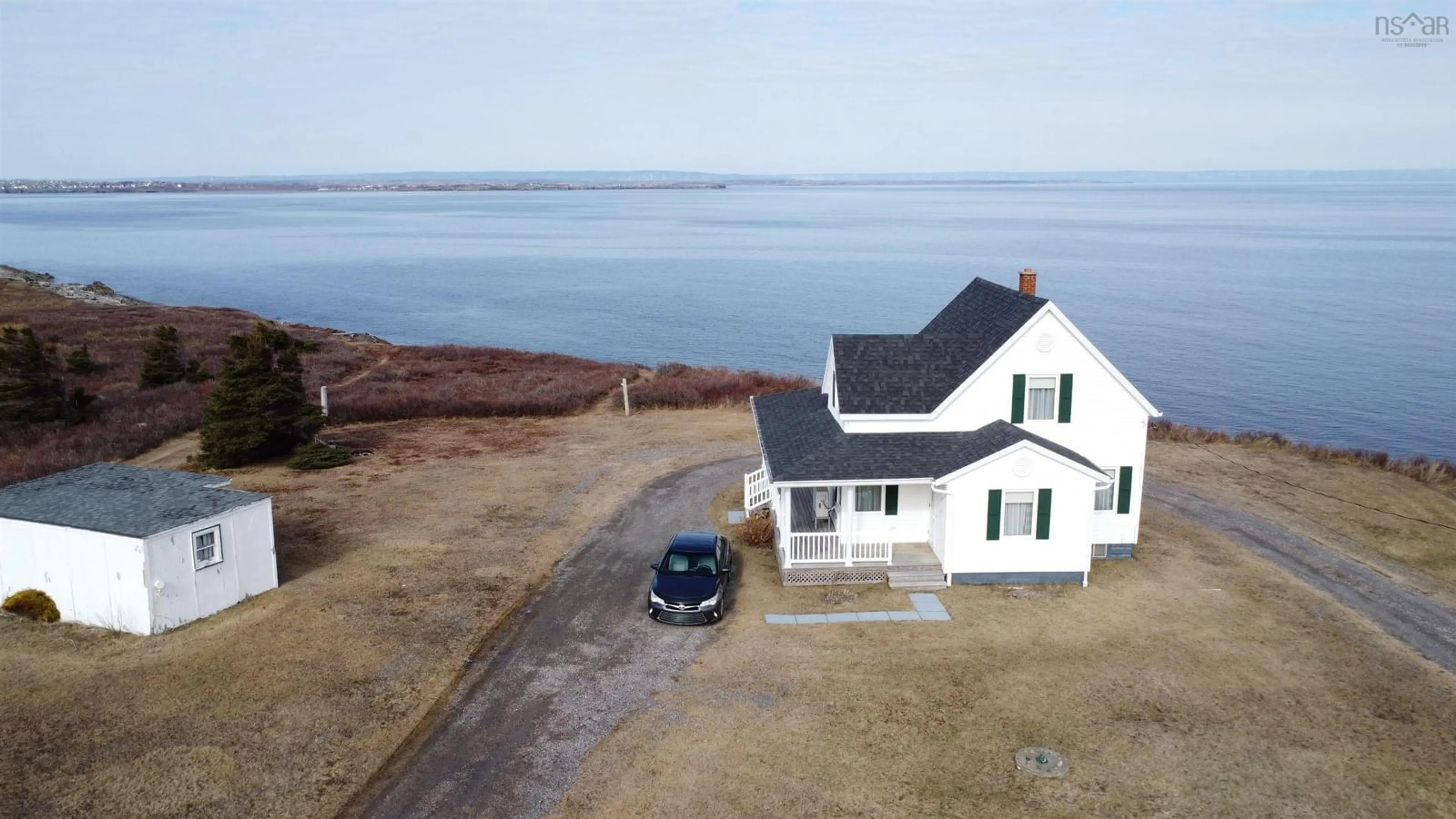 A pic from outside/outdoor area/front of a property/back of a property/a pic from drone, water/lake/river/ocean view for 3403 Highway 28, Victoria Mines Nova Scotia B1N 3J7
