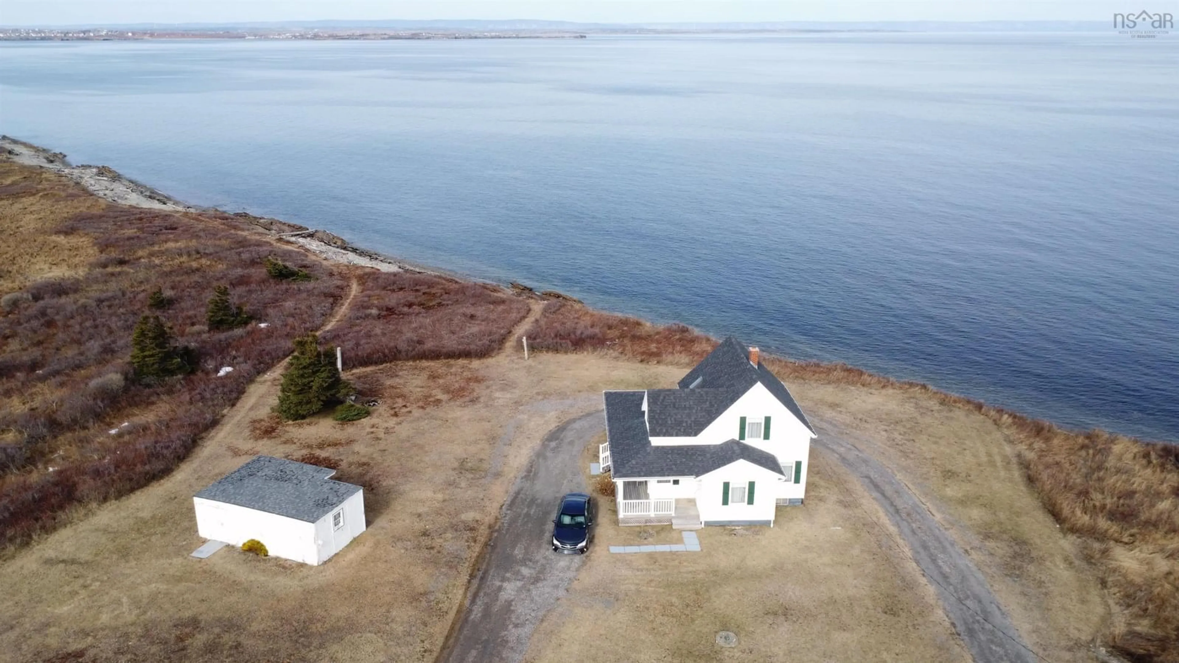 A pic from outside/outdoor area/front of a property/back of a property/a pic from drone, water/lake/river/ocean view for 3403 Highway 28, Victoria Mines Nova Scotia B1N 3J7