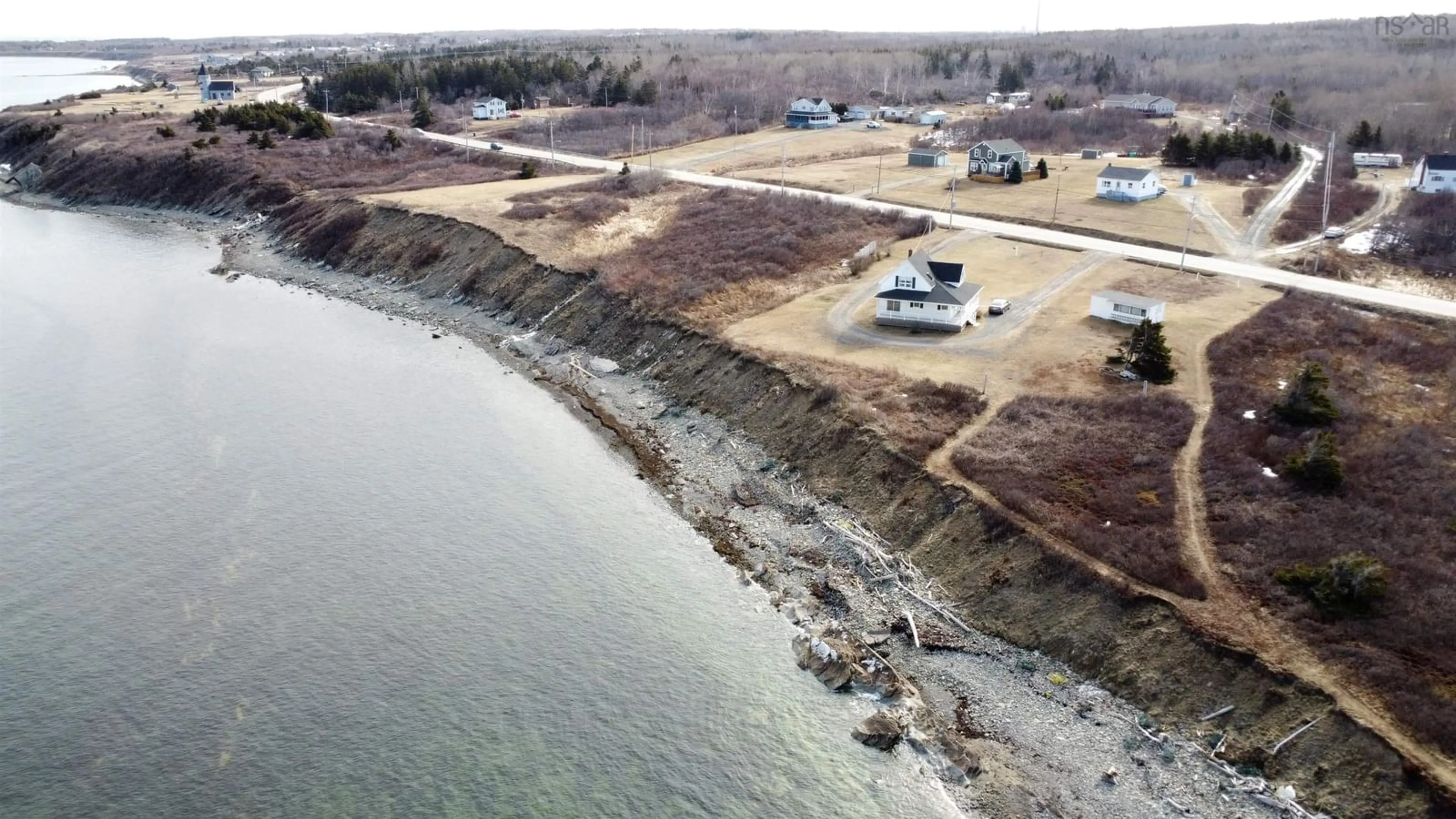 A pic from outside/outdoor area/front of a property/back of a property/a pic from drone, water/lake/river/ocean view for 3403 Highway 28, Victoria Mines Nova Scotia B1N 3J7