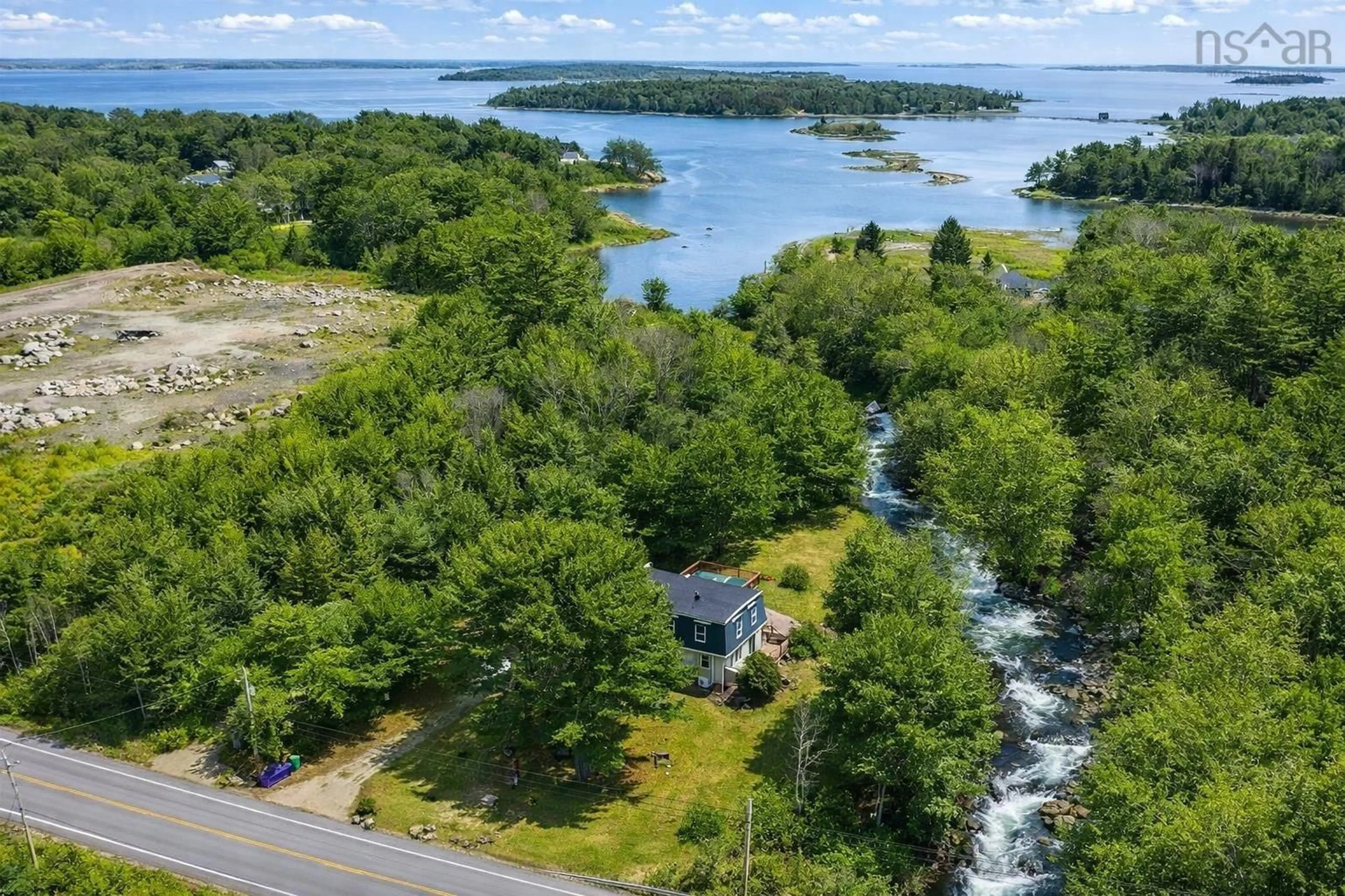A pic from outside/outdoor area/front of a property/back of a property/a pic from drone, water/lake/river/ocean view for 6689 Highway 3 Hwy, Western Shore Nova Scotia B0J 3M0