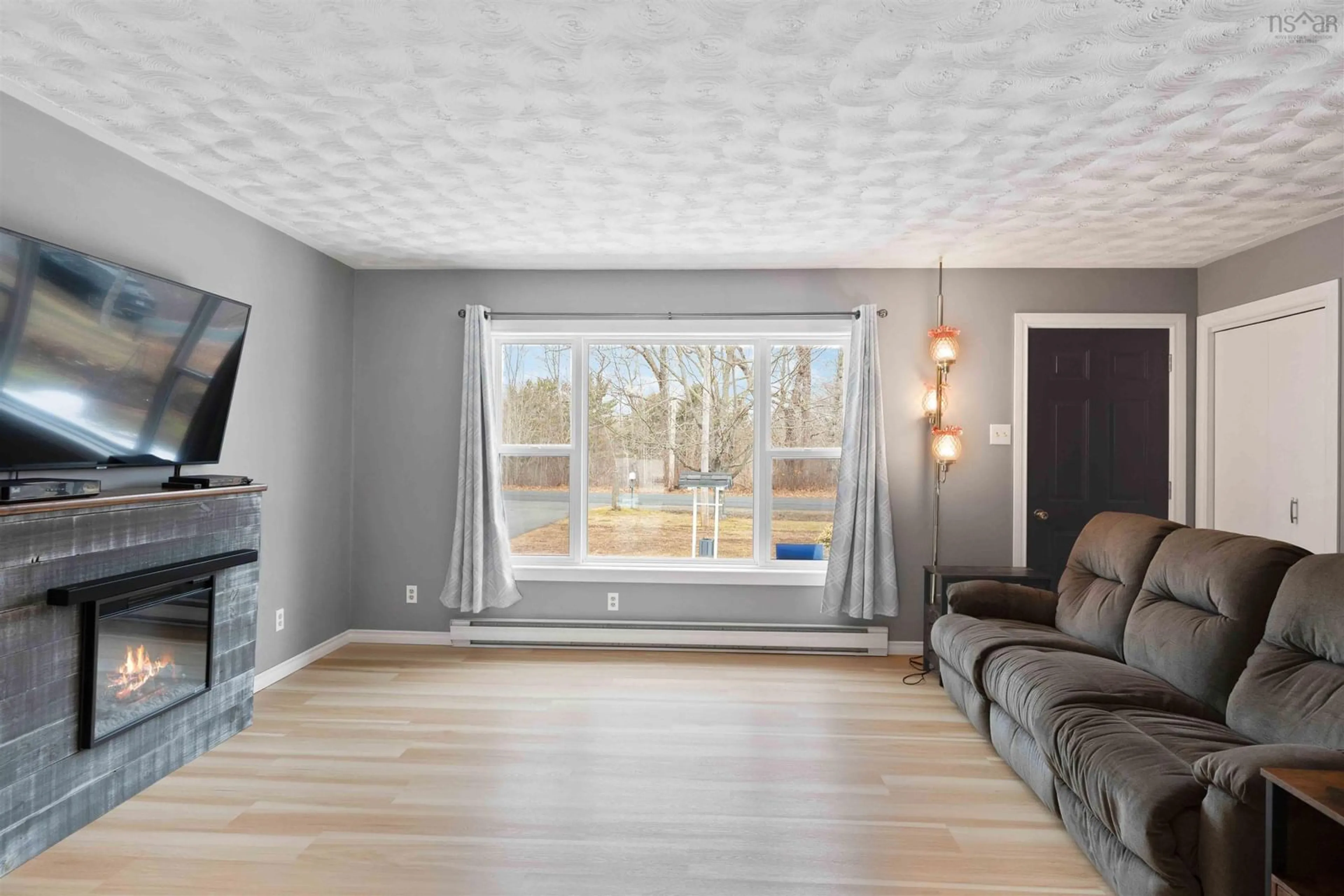 Living room with furniture, wood/laminate floor for 402 Ward Rd, Greenwood Square Nova Scotia B0P 1R0