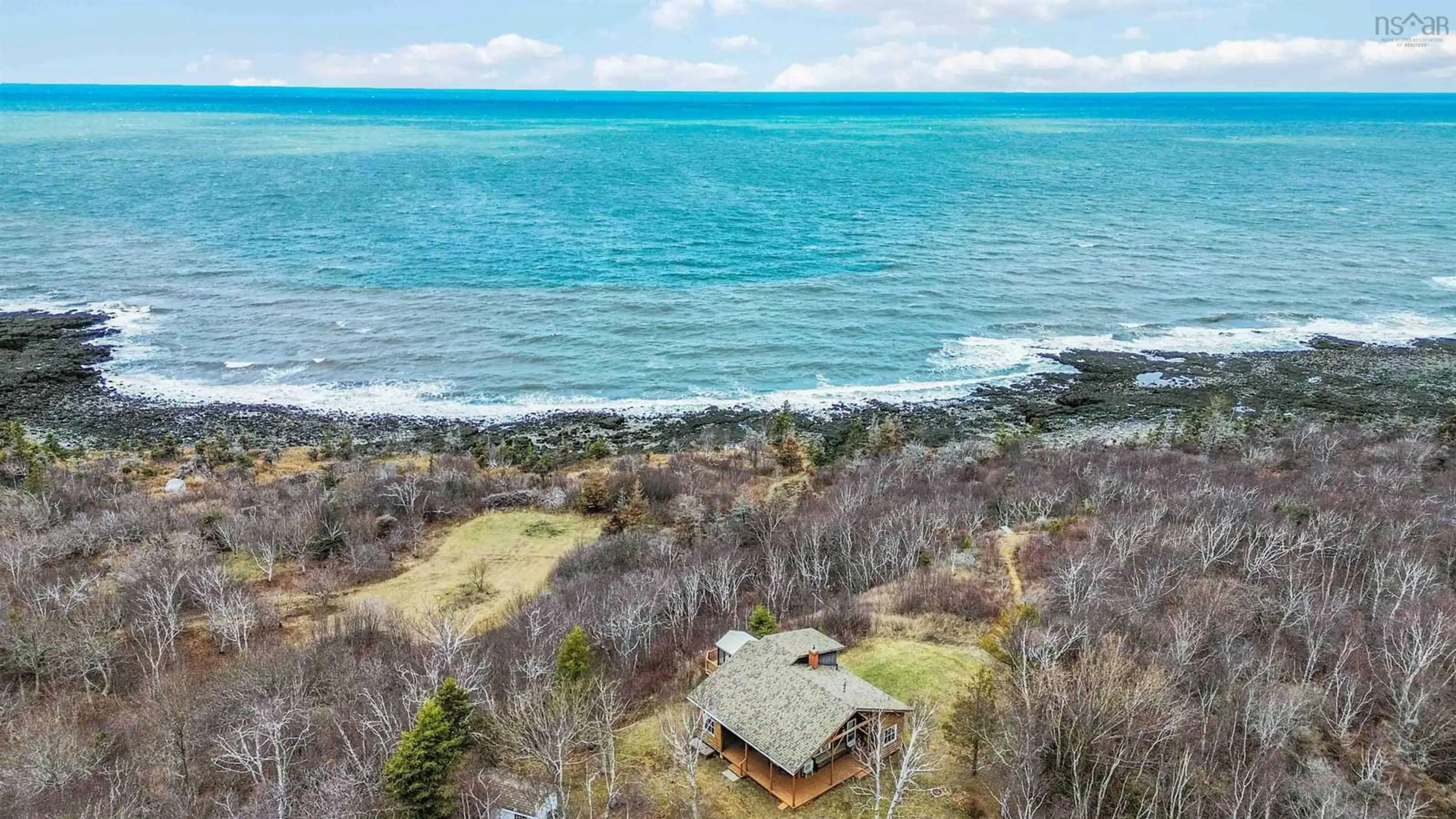 A pic from outside/outdoor area/front of a property/back of a property/a pic from drone, water/lake/river/ocean view for 4805 Shore Rd, Parkers Cove Nova Scotia B0S 1A0
