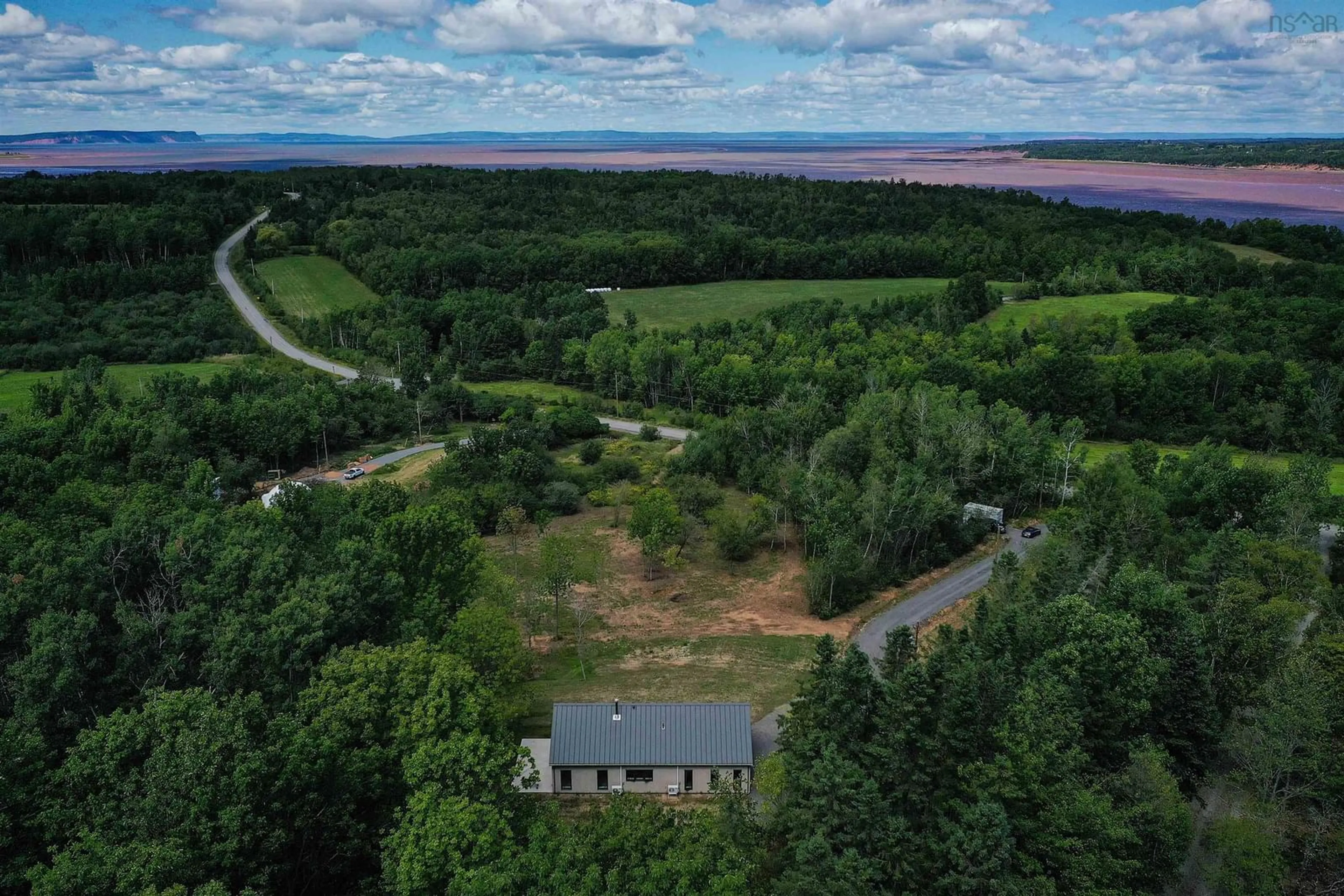 A pic from outside/outdoor area/front of a property/back of a property/a pic from drone, forest/trees view for 800 Bluff Rd, Lockhartville Nova Scotia B0P 1H0