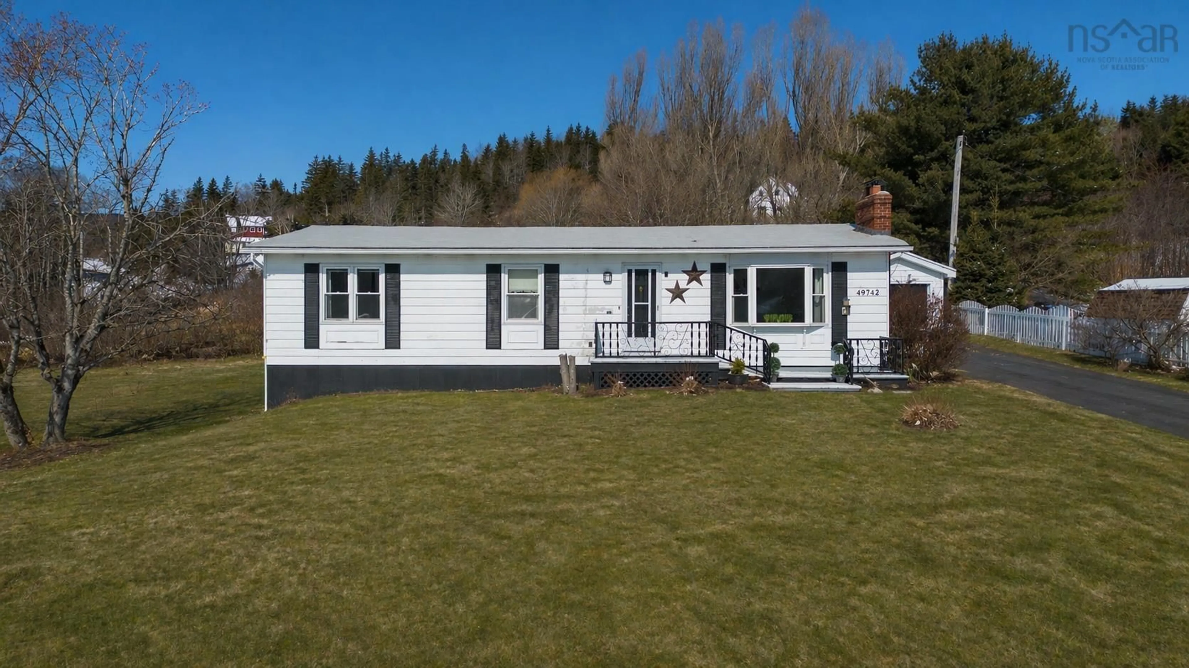 Home with vinyl exterior material, street for 49742 Cabot Trail, Goose Cove Nova Scotia B0E 1B0