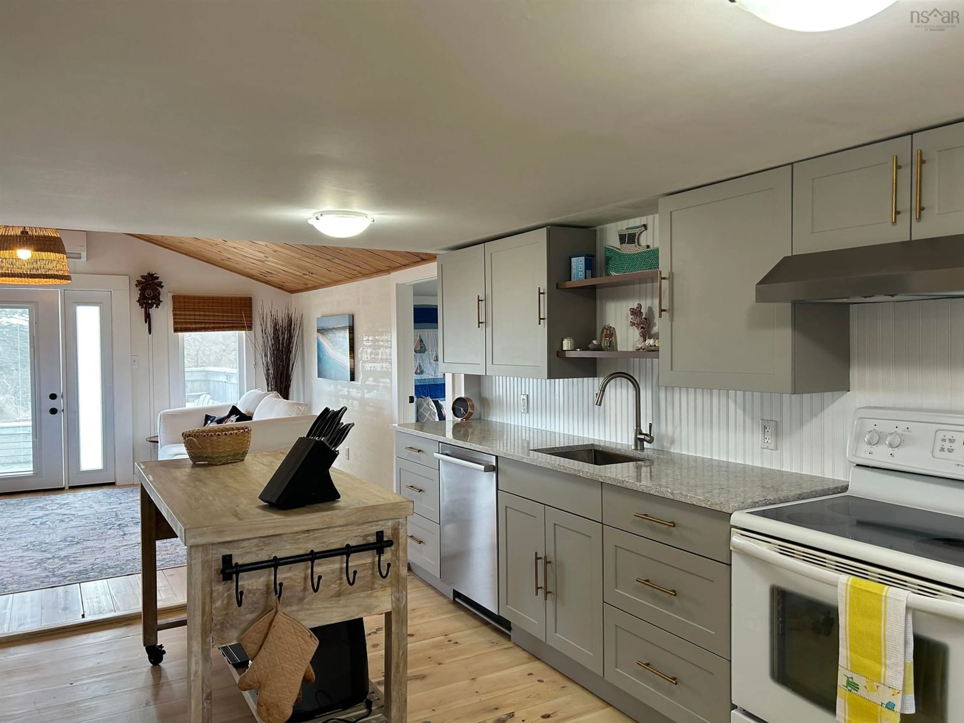 Open concept kitchen, wood/laminate floor for 68 Daniels Head Rd, South Side Nova Scotia B0W 1P0