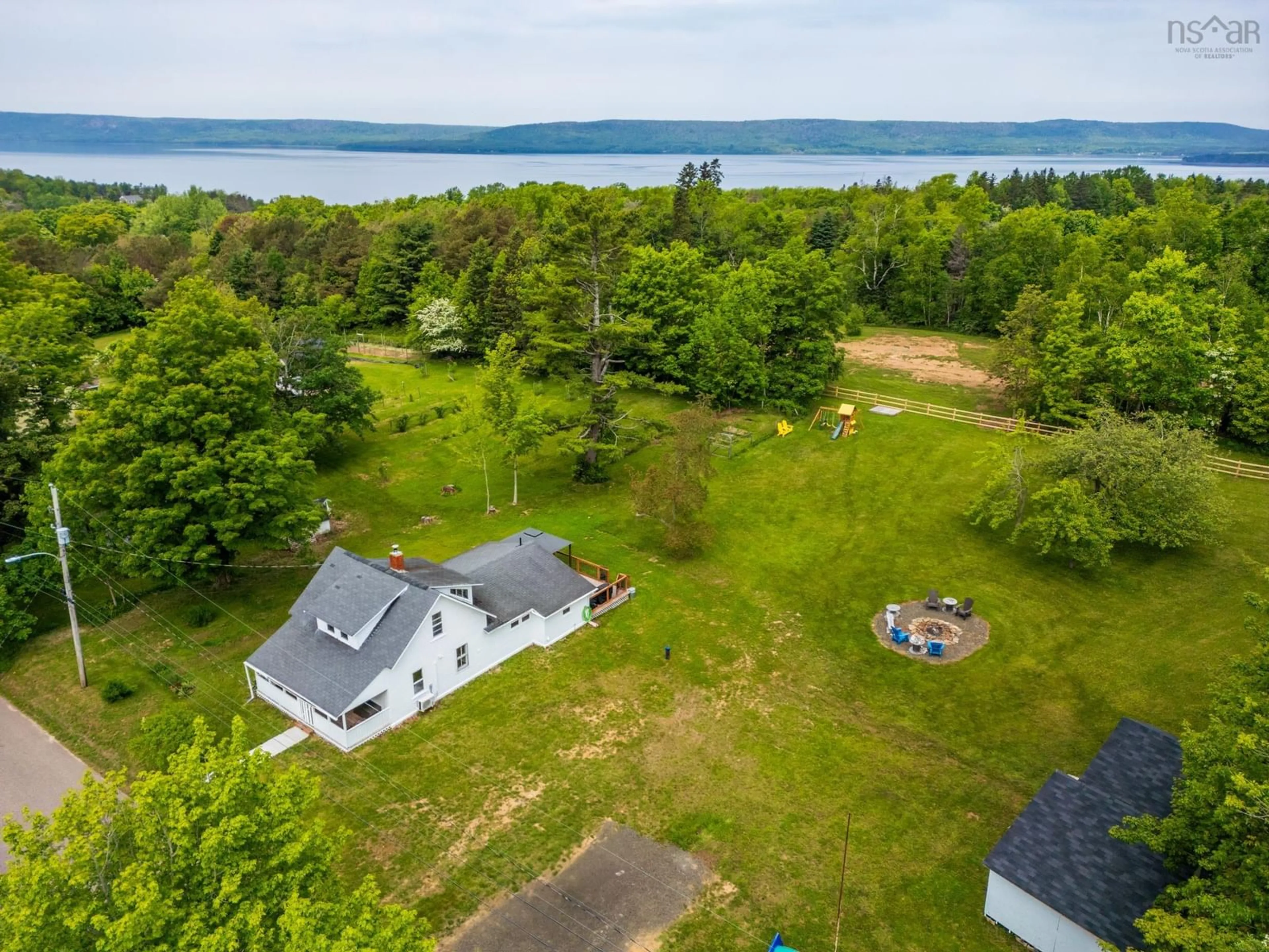 A pic from outside/outdoor area/front of a property/back of a property/a pic from drone, water/lake/river/ocean view for 51 Shawmut Ave, Clementsport Nova Scotia B0S 1A0