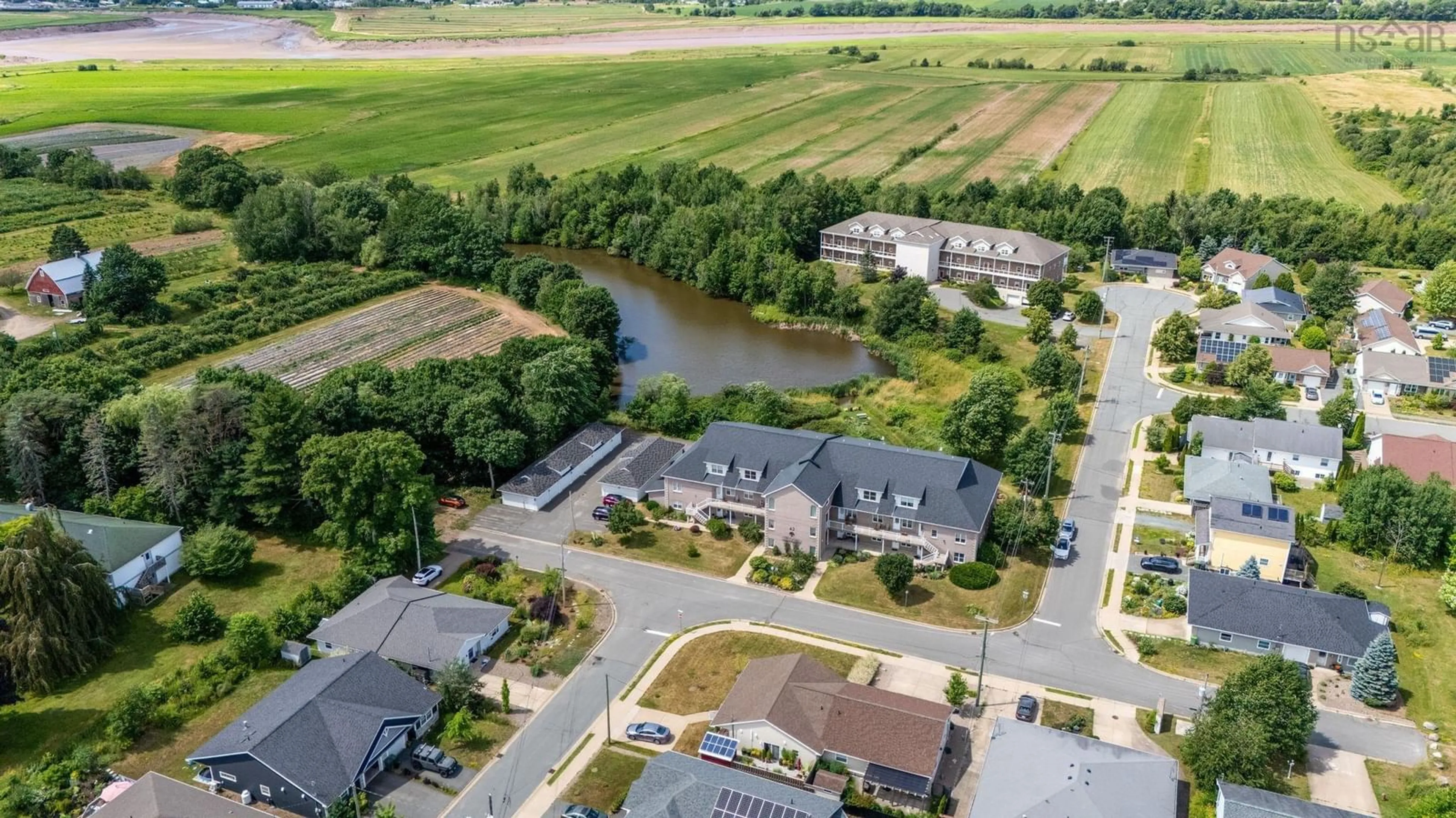 A pic from outside/outdoor area/front of a property/back of a property/a pic from drone, water/lake/river/ocean view for 42 Bigelow St #302, Wolfville Nova Scotia B4P 0A4