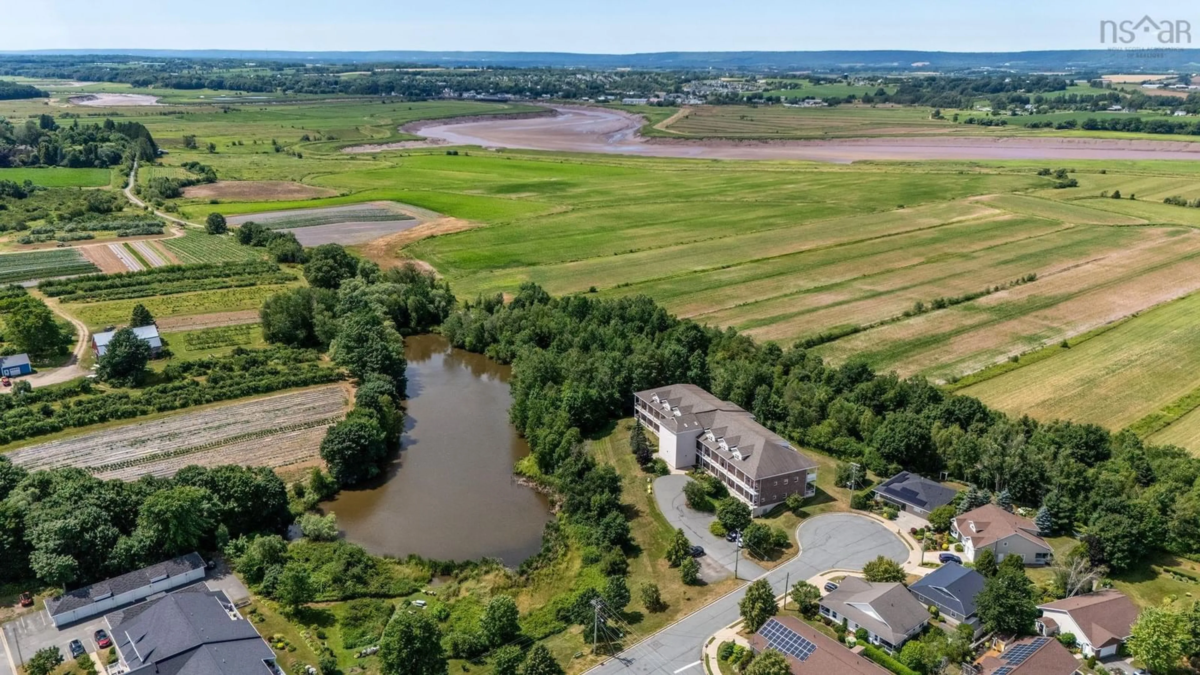 A pic from outside/outdoor area/front of a property/back of a property/a pic from drone, water/lake/river/ocean view for 42 Bigelow St #302, Wolfville Nova Scotia B4P 0A4