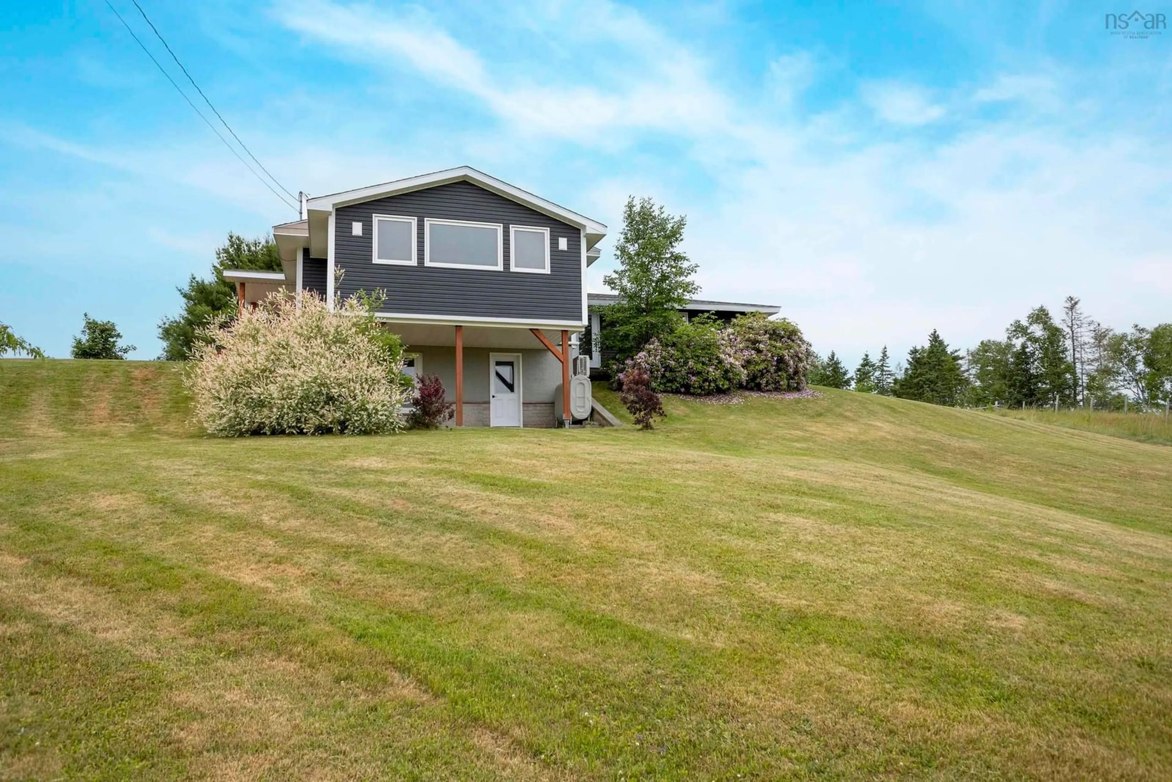 A pic from outside/outdoor area/front of a property/back of a property/a pic from drone, water/lake/river/ocean view for 271 376 Hwy, Central West River Nova Scotia B0K 1H0