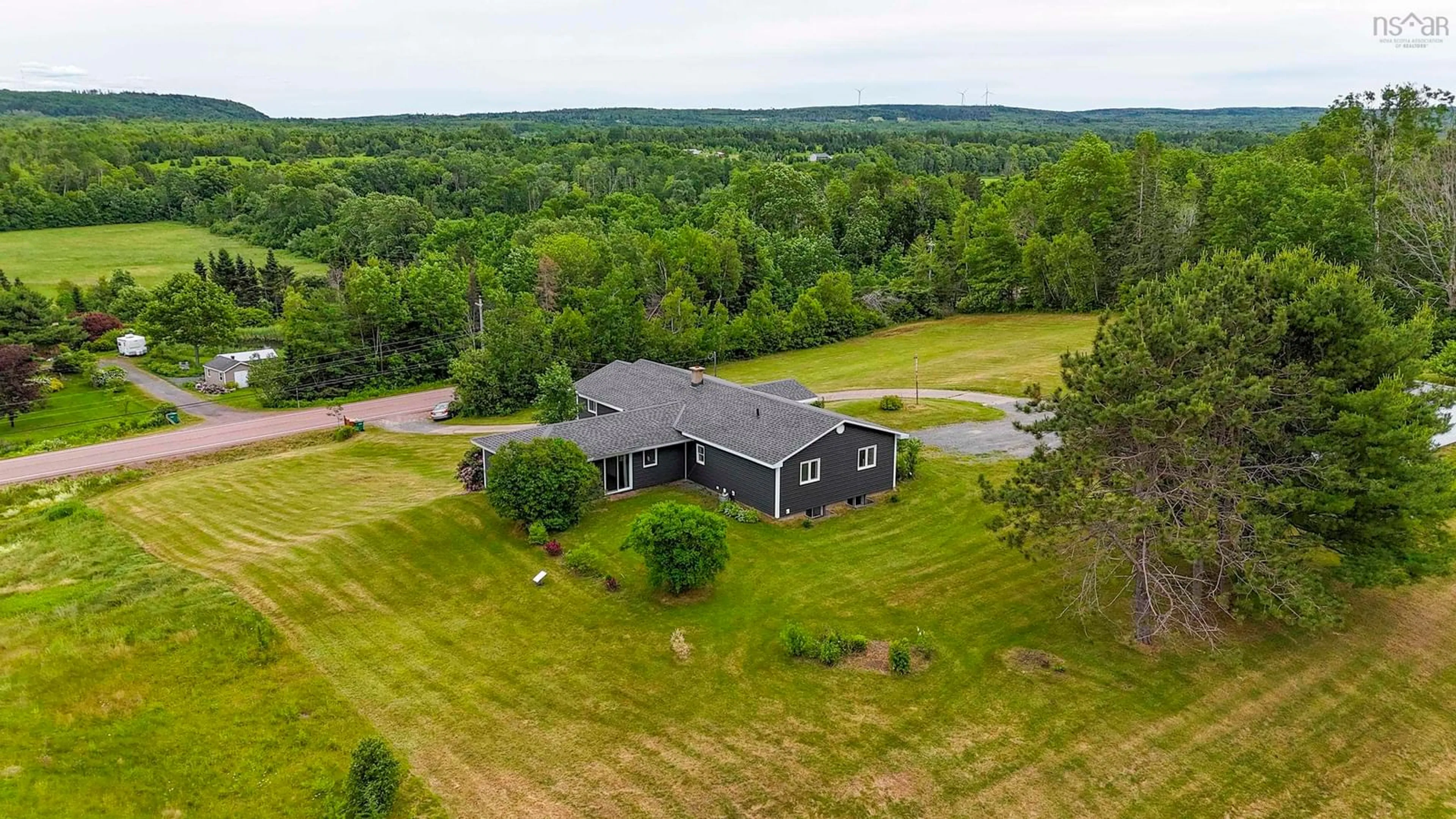 A pic from outside/outdoor area/front of a property/back of a property/a pic from drone, water/lake/river/ocean view for 271 376 Hwy, Central West River Nova Scotia B0K 1H0
