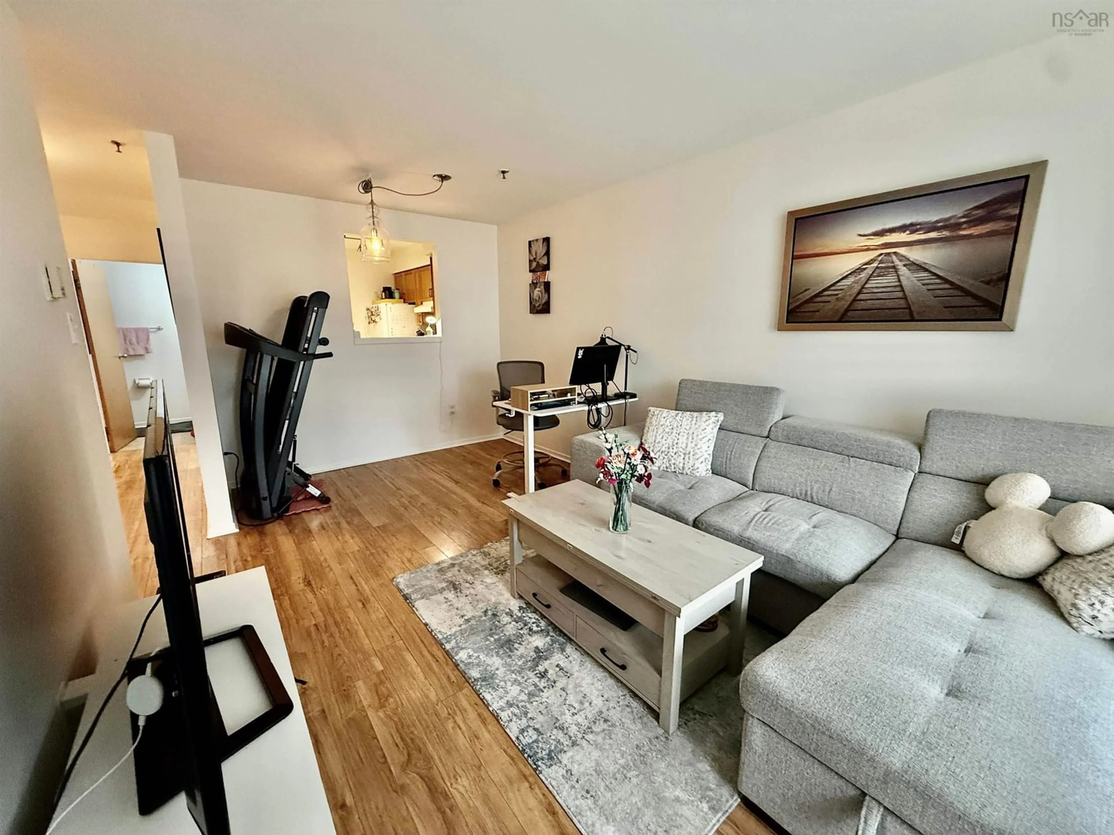 Living room with furniture, wood/laminate floor for 5230 Tobin St #103, Halifax Nova Scotia B3H 1S2
