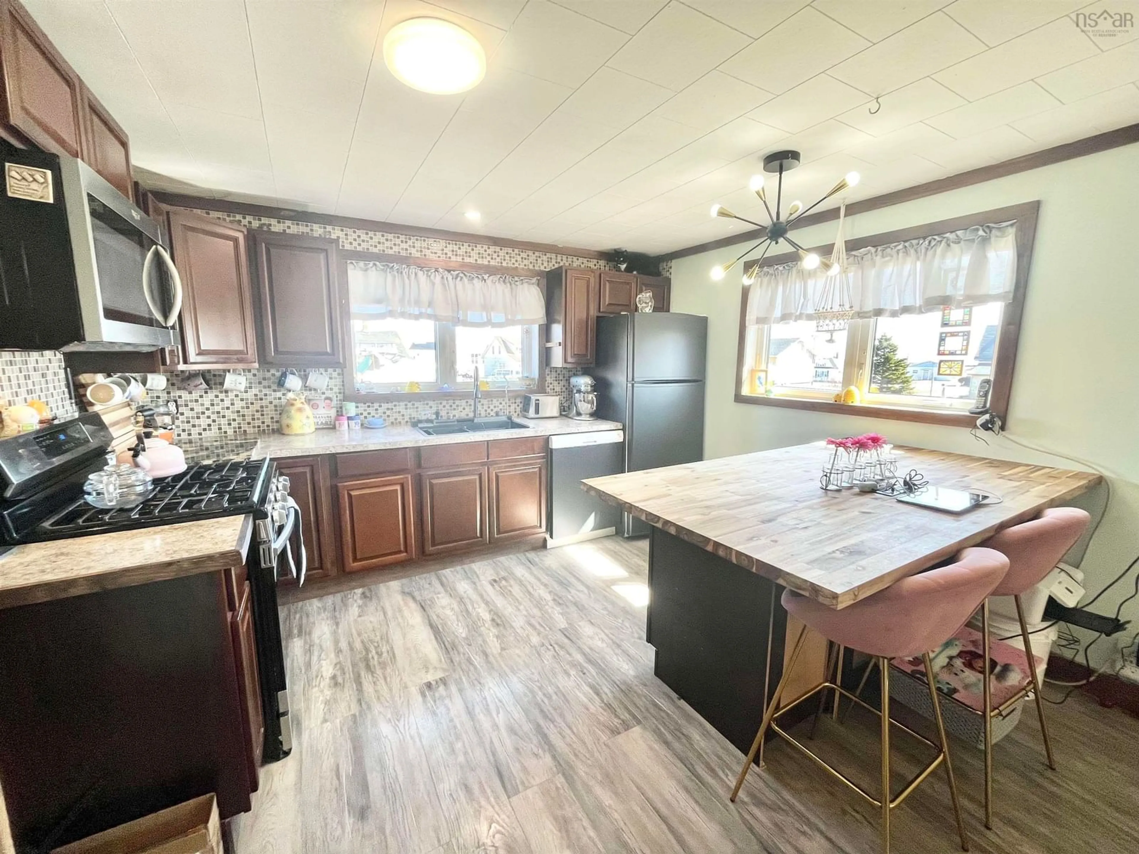 Open concept kitchen, wood/laminate floor for 2645 Main St, Clark's Harbour Nova Scotia B0W 1P0
