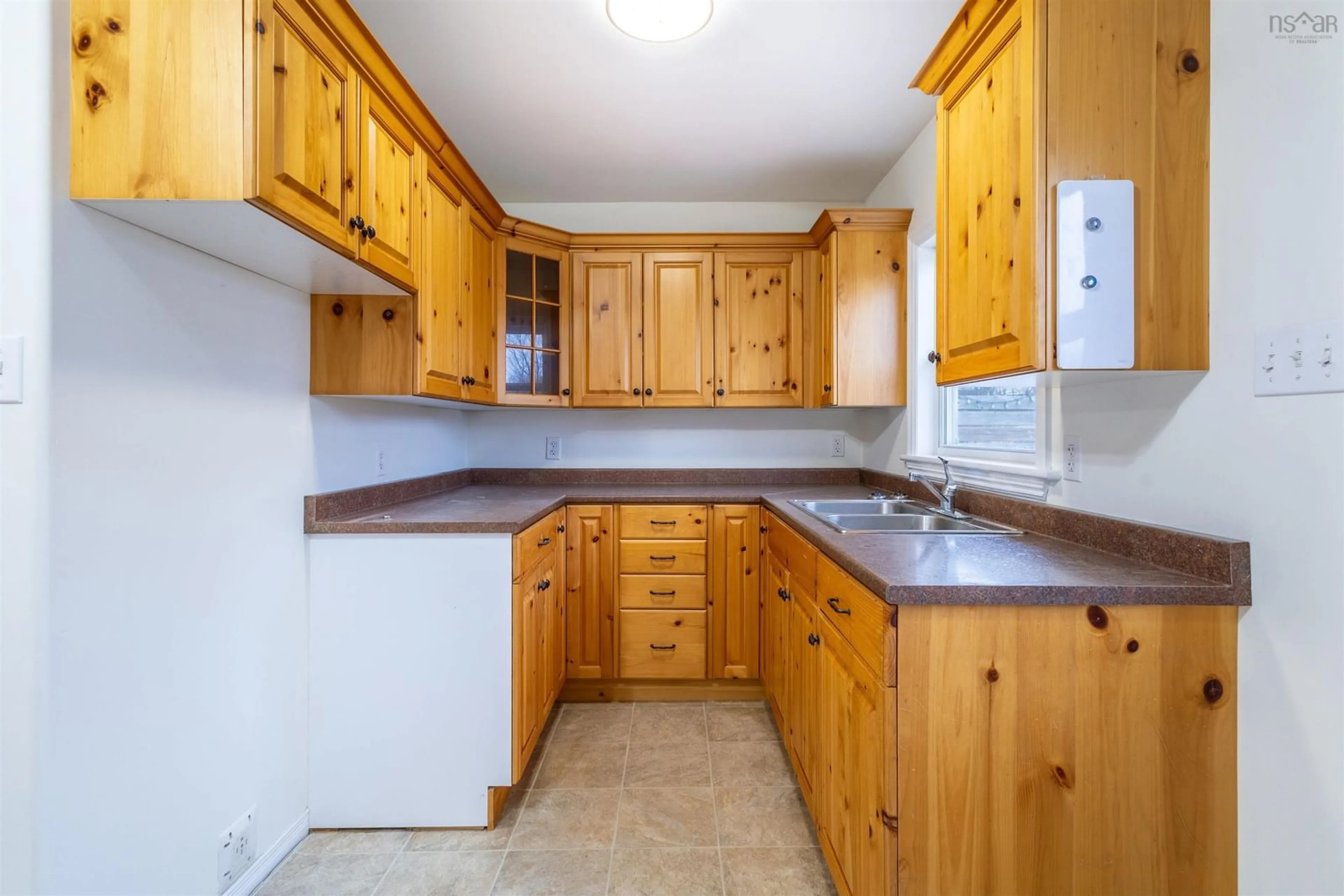 Standard kitchen, wood/laminate floor for 22 Archibald St, Sydney Mines Nova Scotia B1V 2Y5
