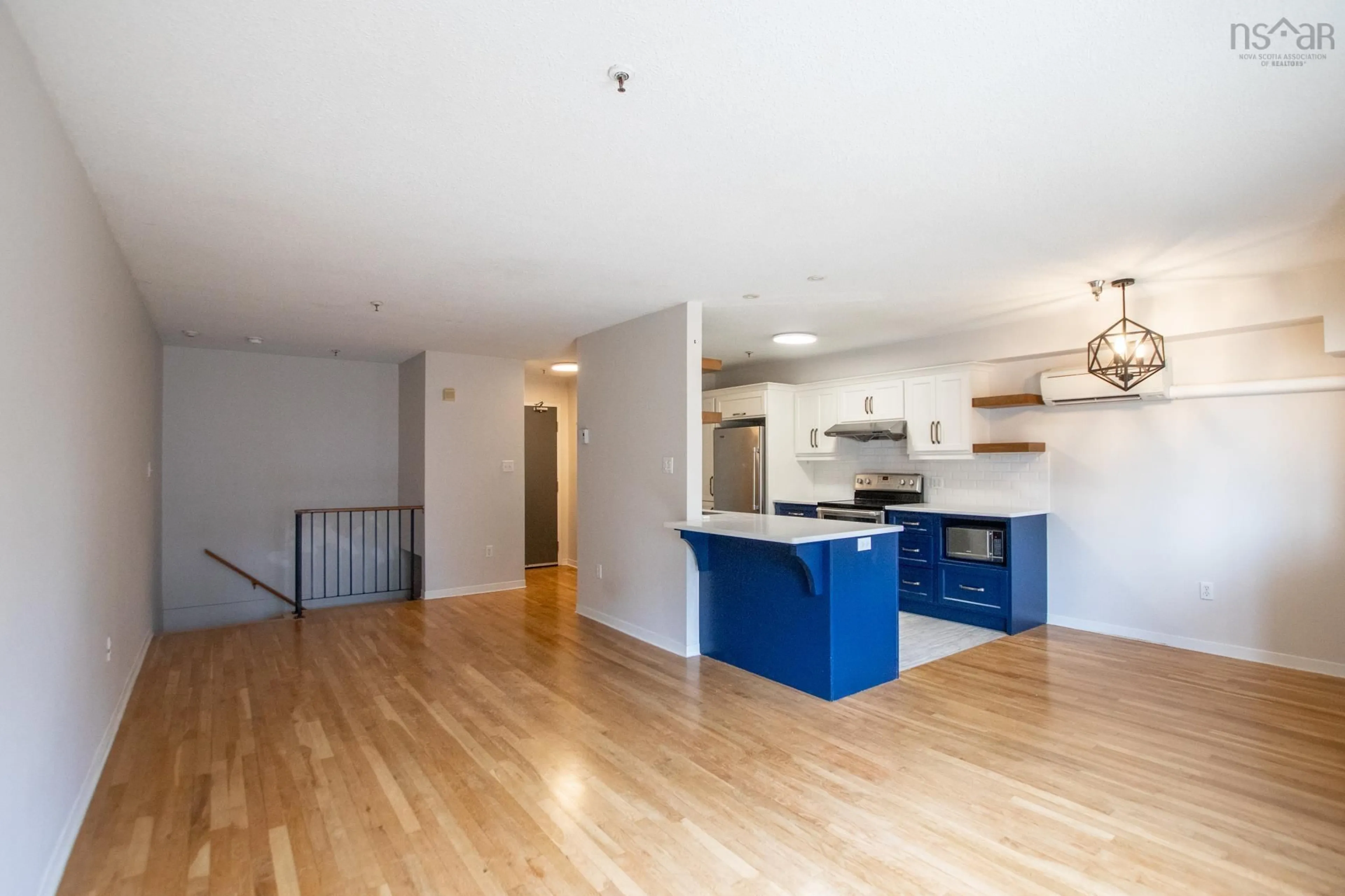 Open concept kitchen, wood/laminate floor for 2070 Quingate Pl #227, Halifax Nova Scotia B3L 4S1