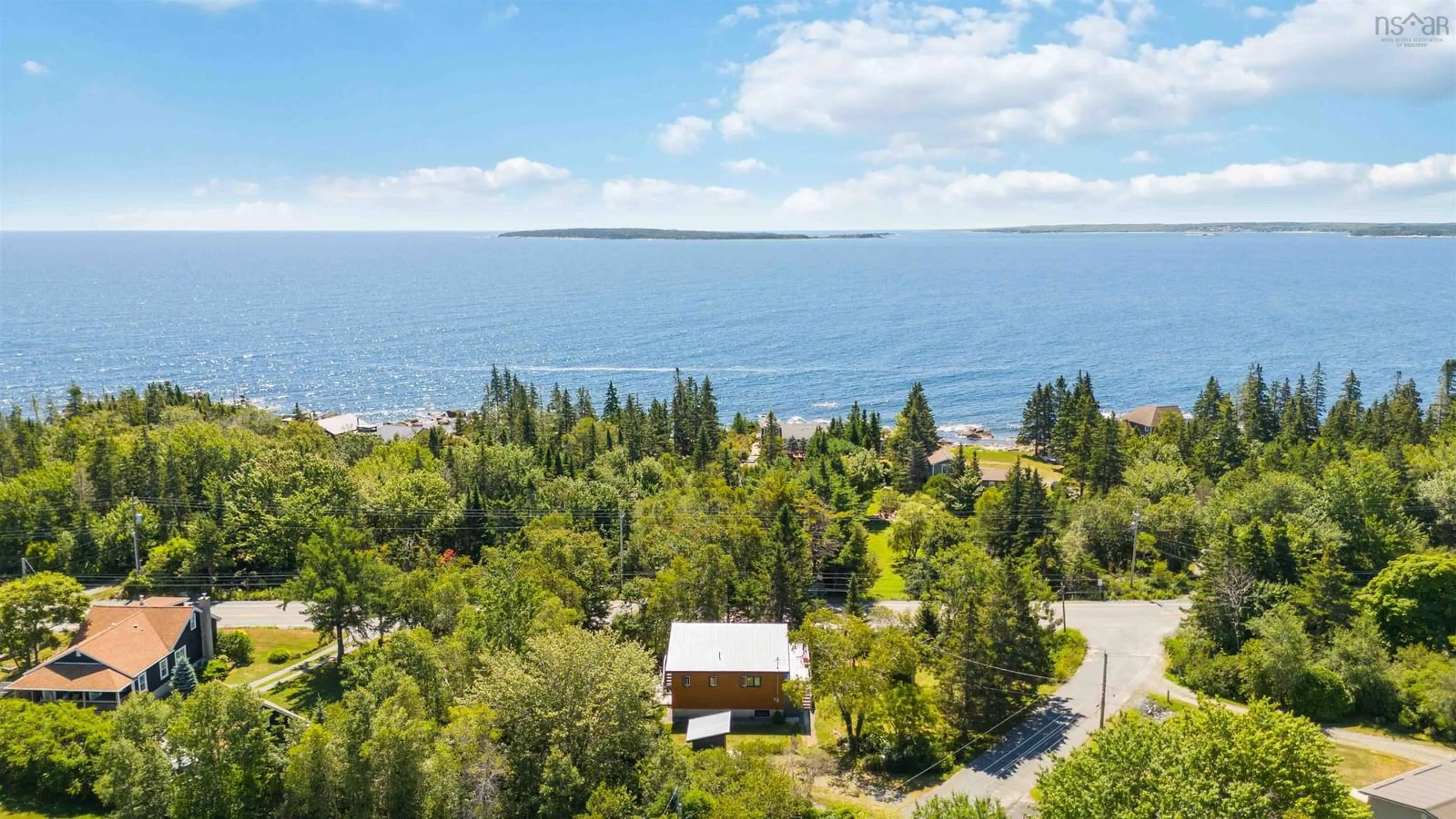 A pic from outside/outdoor area/front of a property/back of a property/a pic from drone, water/lake/river/ocean view for 10 Silver Rock Rd, Hunts Point Nova Scotia B0T 1G0
