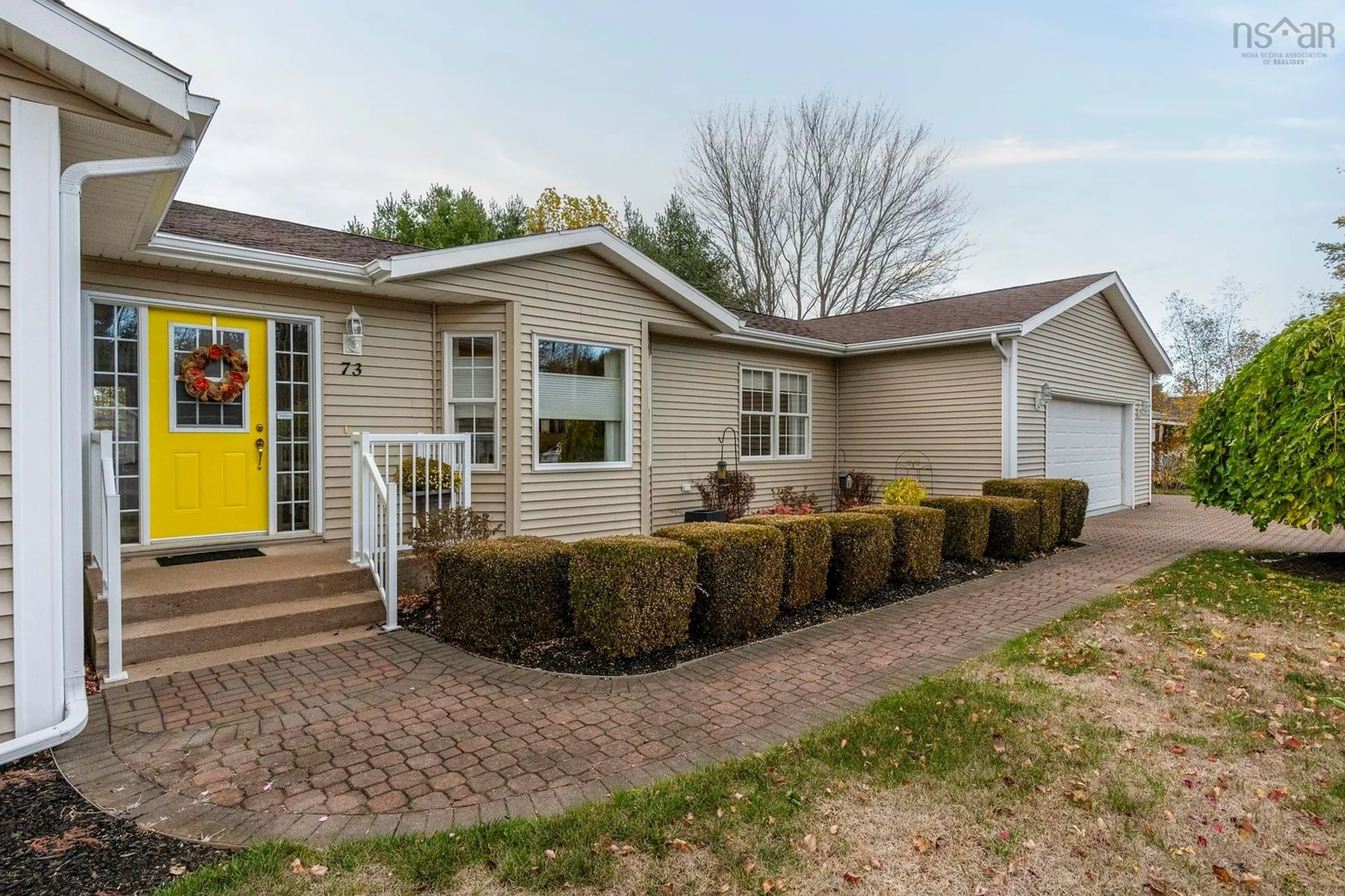 Home with vinyl exterior material, street for 73 Gravenstein Dr, Berwick Nova Scotia B0P 1E0