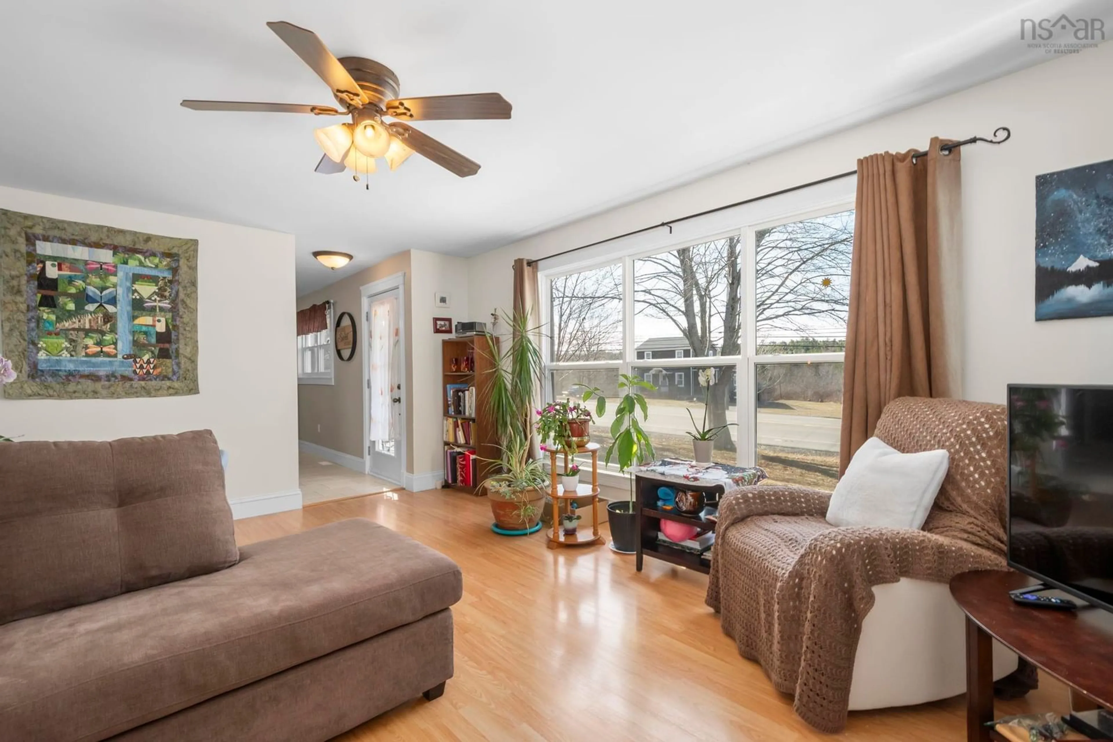 Living room with furniture, wood/laminate floor for 4593 Highway 1, Three Mile Plains Nova Scotia B0N 2T0