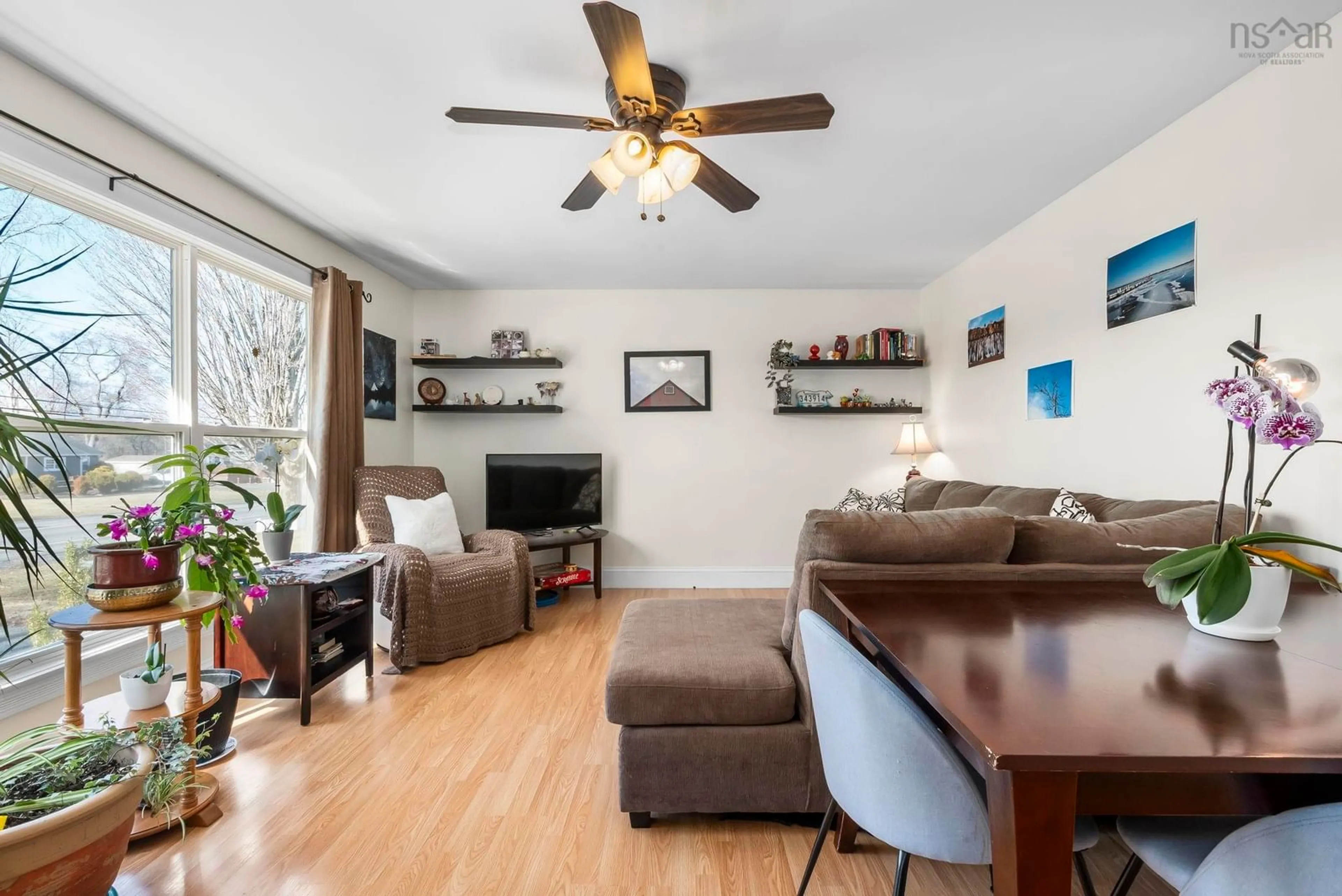 Living room with furniture, wood/laminate floor for 4593 Highway 1, Three Mile Plains Nova Scotia B0N 2T0