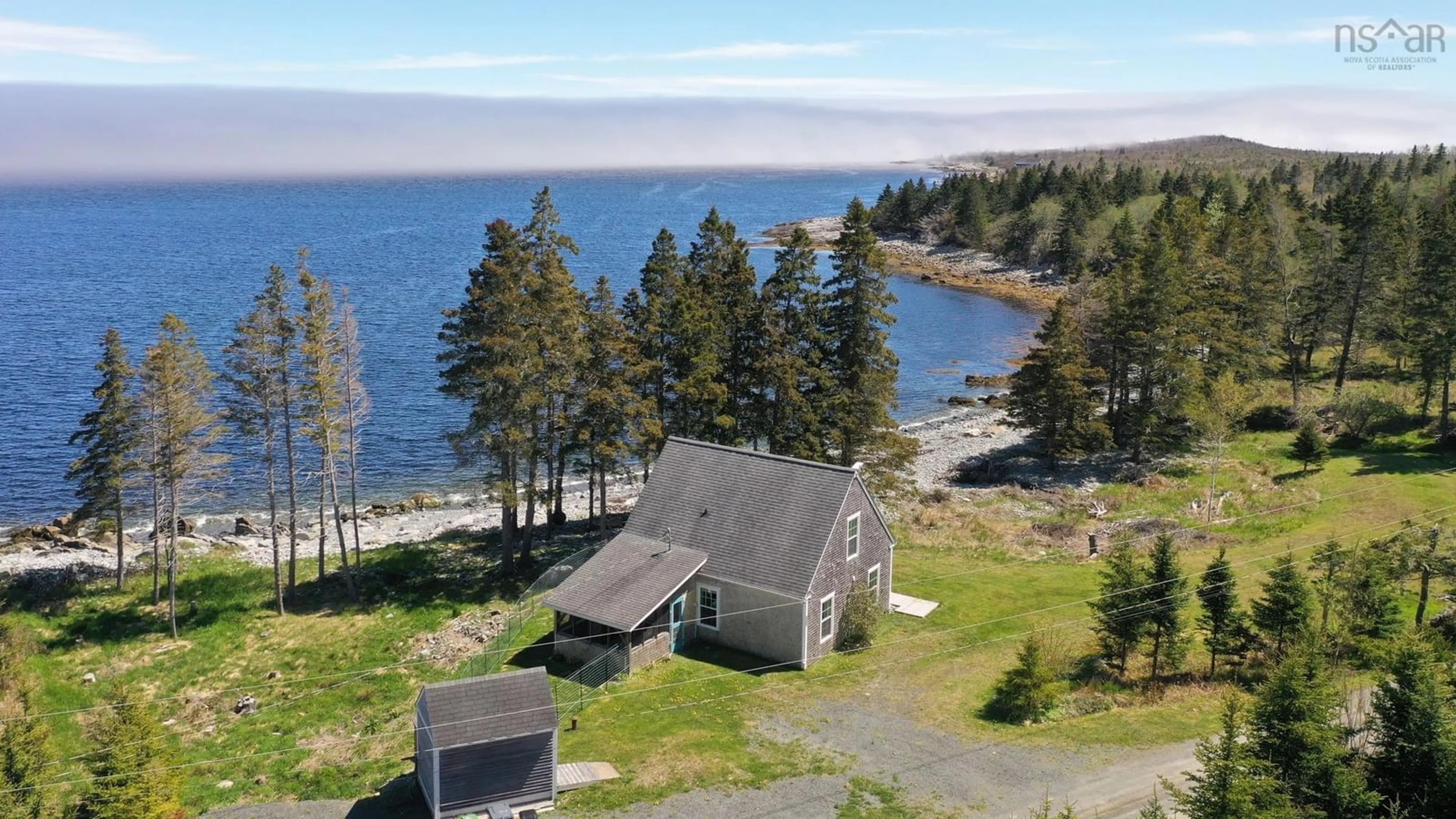 A pic from outside/outdoor area/front of a property/back of a property/a pic from drone, water/lake/river/ocean view for 569 Long Cove Rd, Port Medway Nova Scotia B0J 2T0