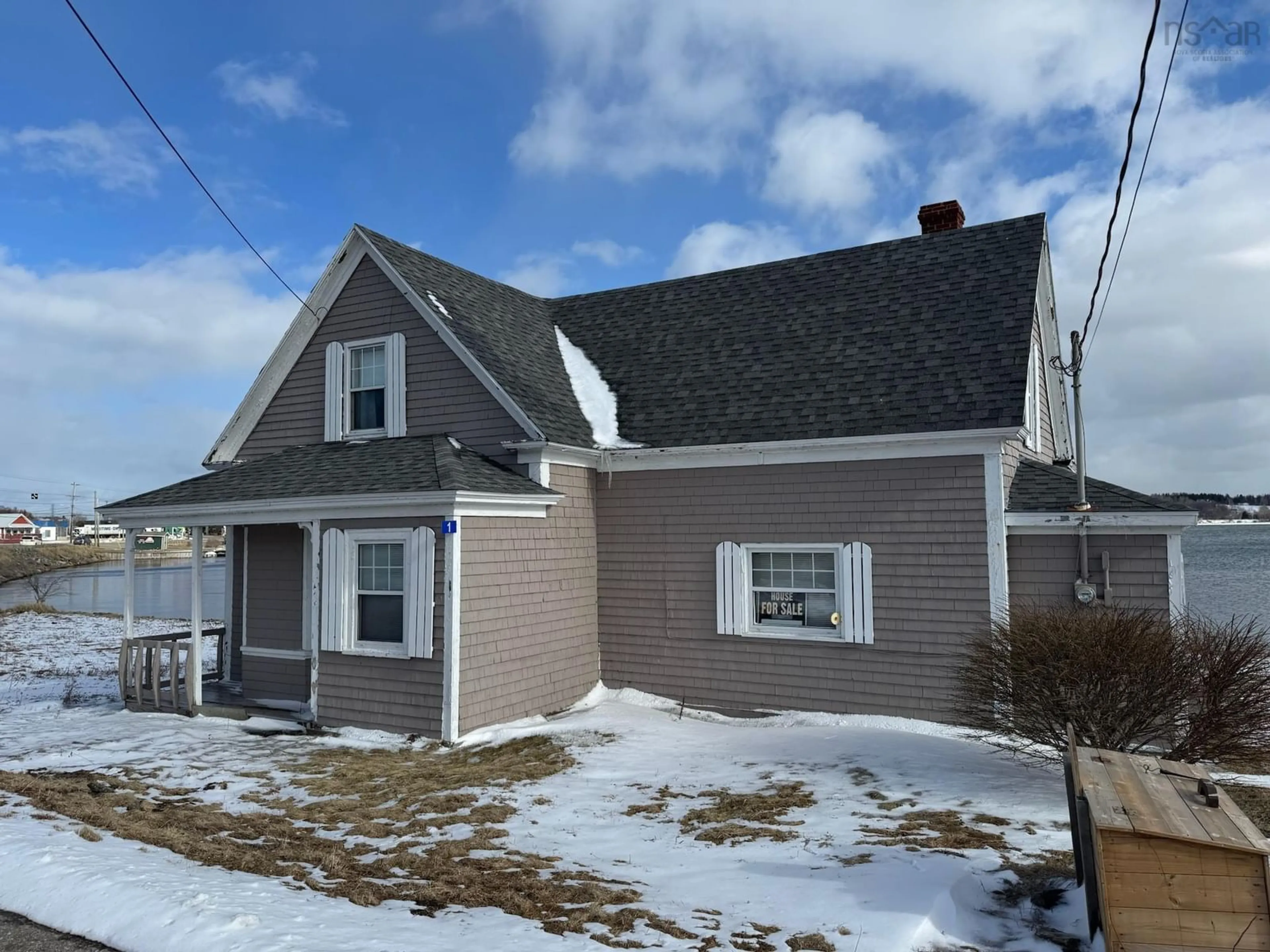 Home with vinyl exterior material, street for 1 Hillside Boularderie Rd, Groves Point Nova Scotia B1Y 2X4