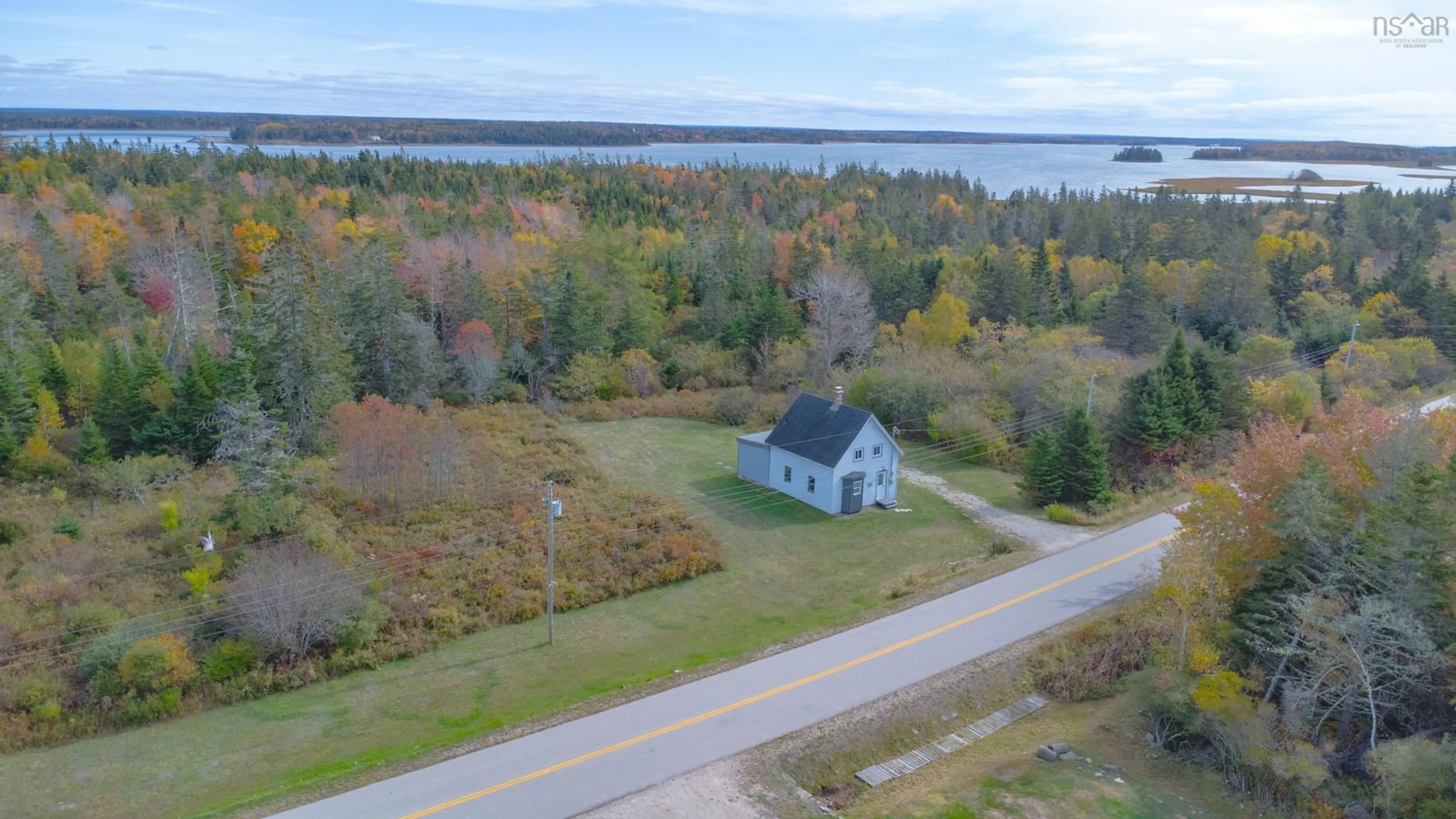 A pic from outside/outdoor area/front of a property/back of a property/a pic from drone, water/lake/river/ocean view for 371 Chemin Des Ben, Sluice Point Nova Scotia B0W 3M0