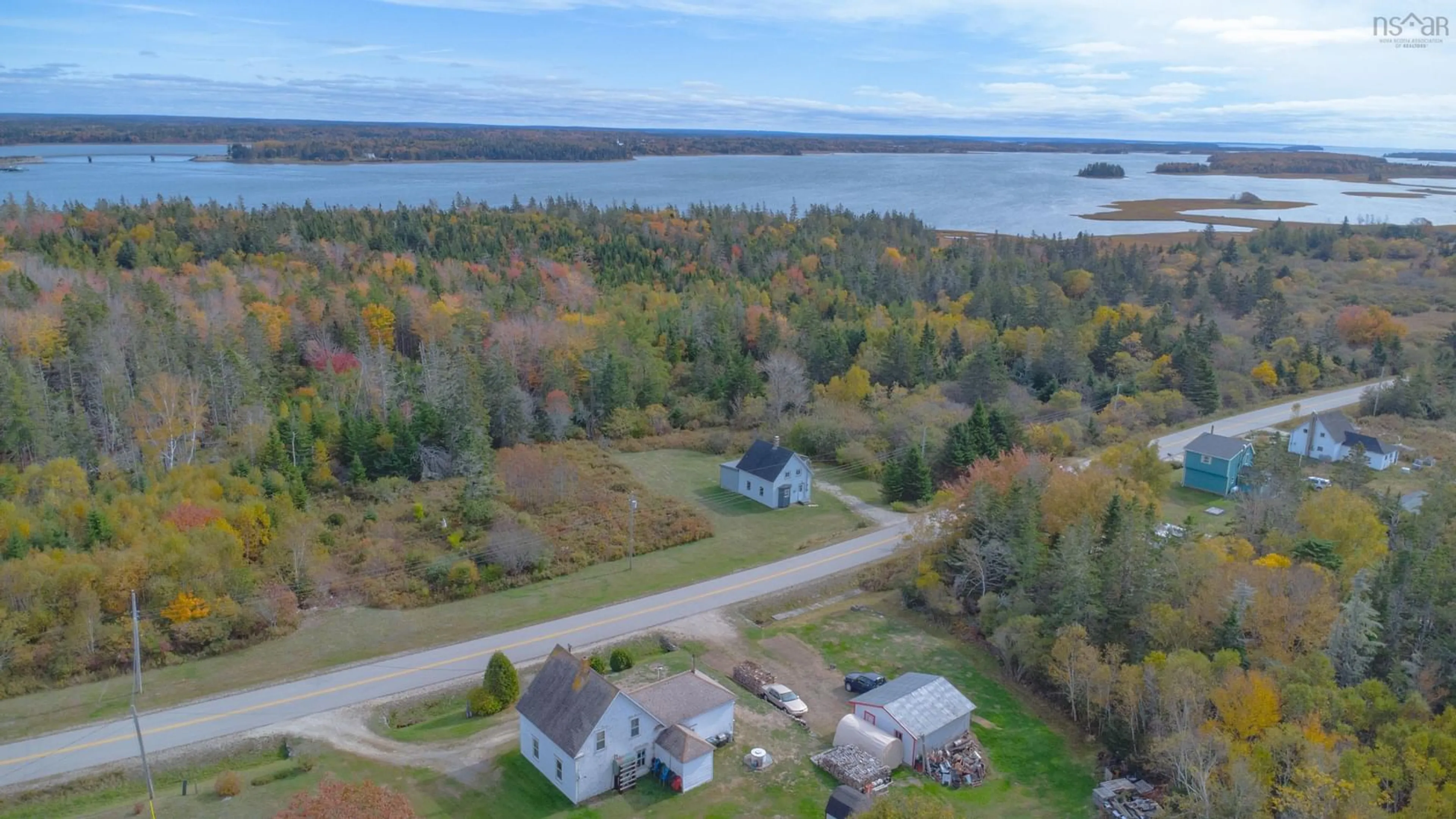 A pic from outside/outdoor area/front of a property/back of a property/a pic from drone, water/lake/river/ocean view for 371 Chemin Des Ben, Sluice Point Nova Scotia B0W 3M0