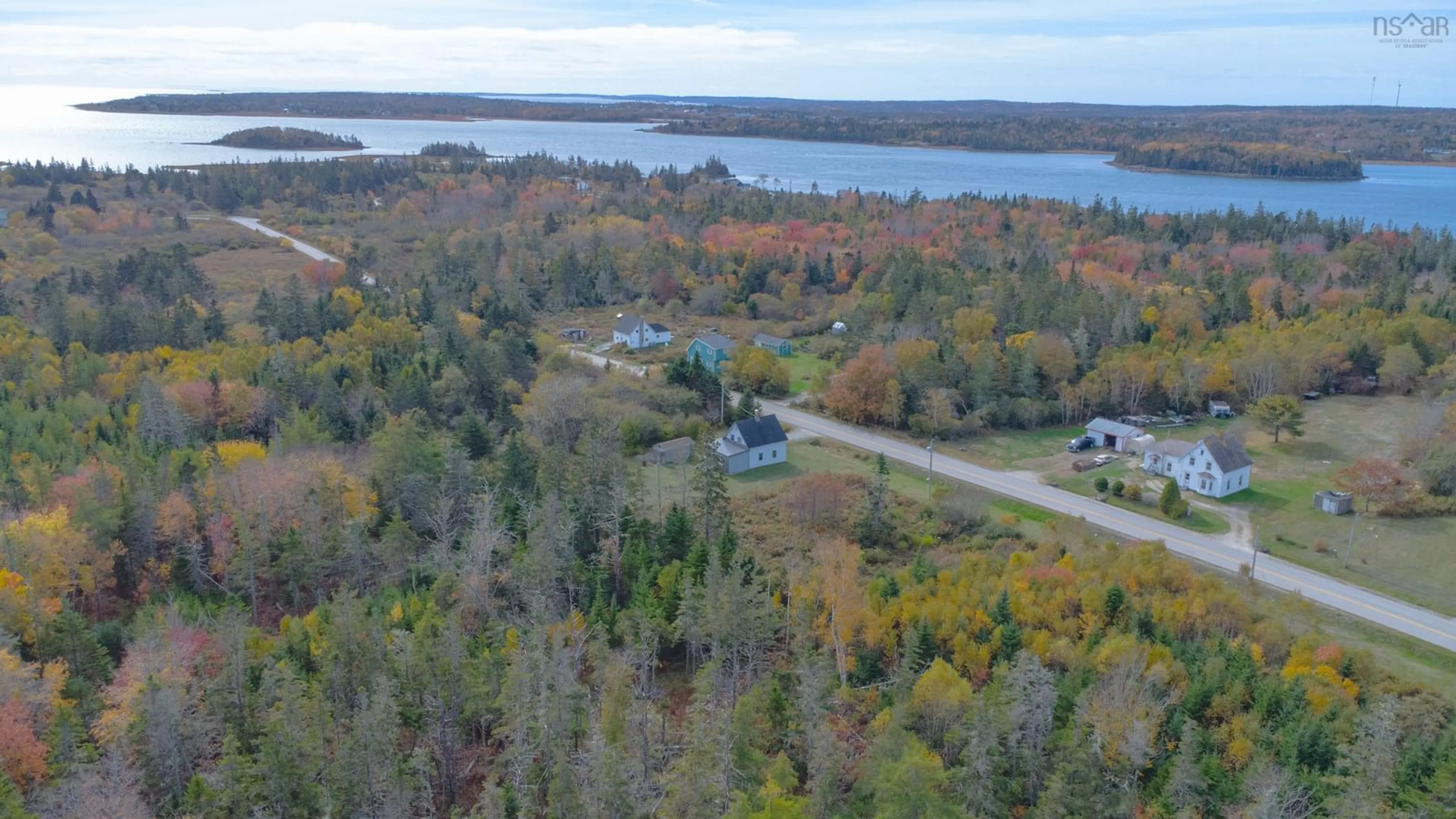 A pic from outside/outdoor area/front of a property/back of a property/a pic from drone, water/lake/river/ocean view for 371 Chemin Des Ben, Sluice Point Nova Scotia B0W 3M0